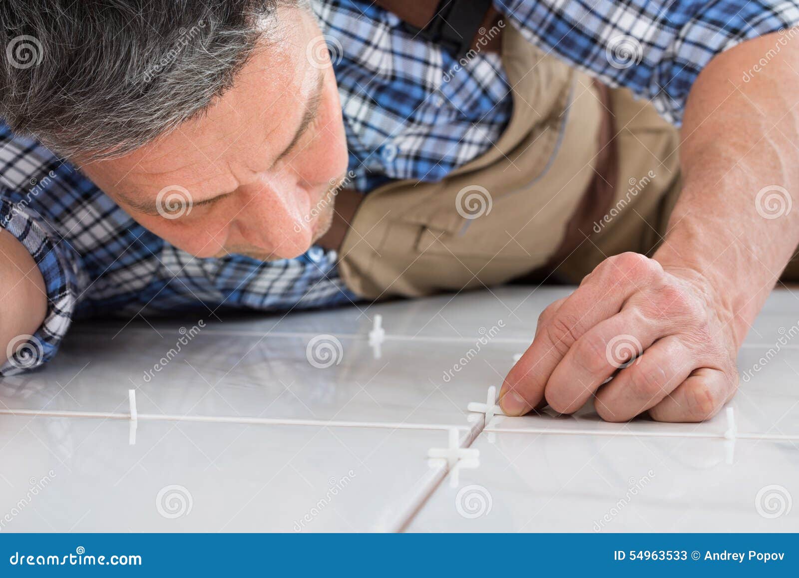 Handyman Placing Spacers between Tiles Stock Image Image of installer