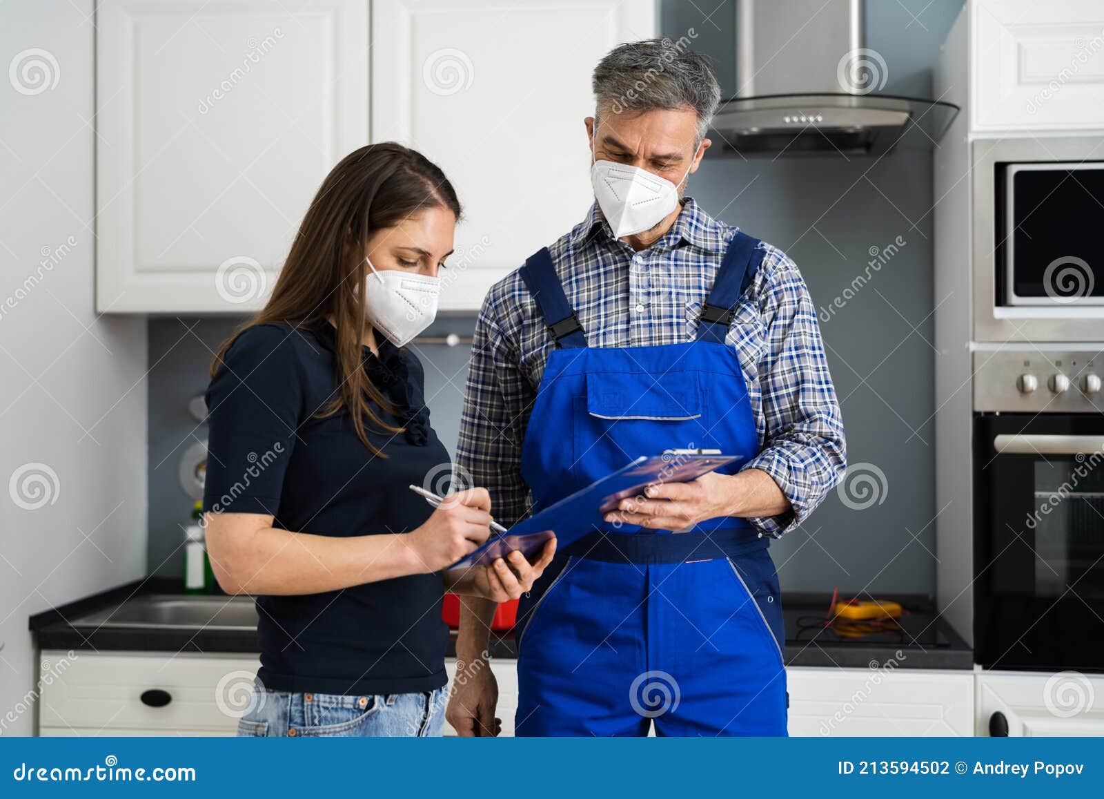 Handyman Plumber and Customer with Service Contract Stock Photo Image