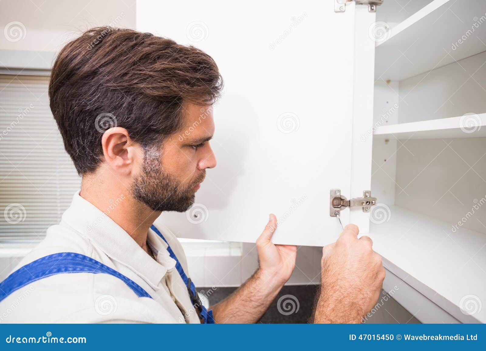 Handyman Putting Up a Shelf Stock Photo Image of male, repairman