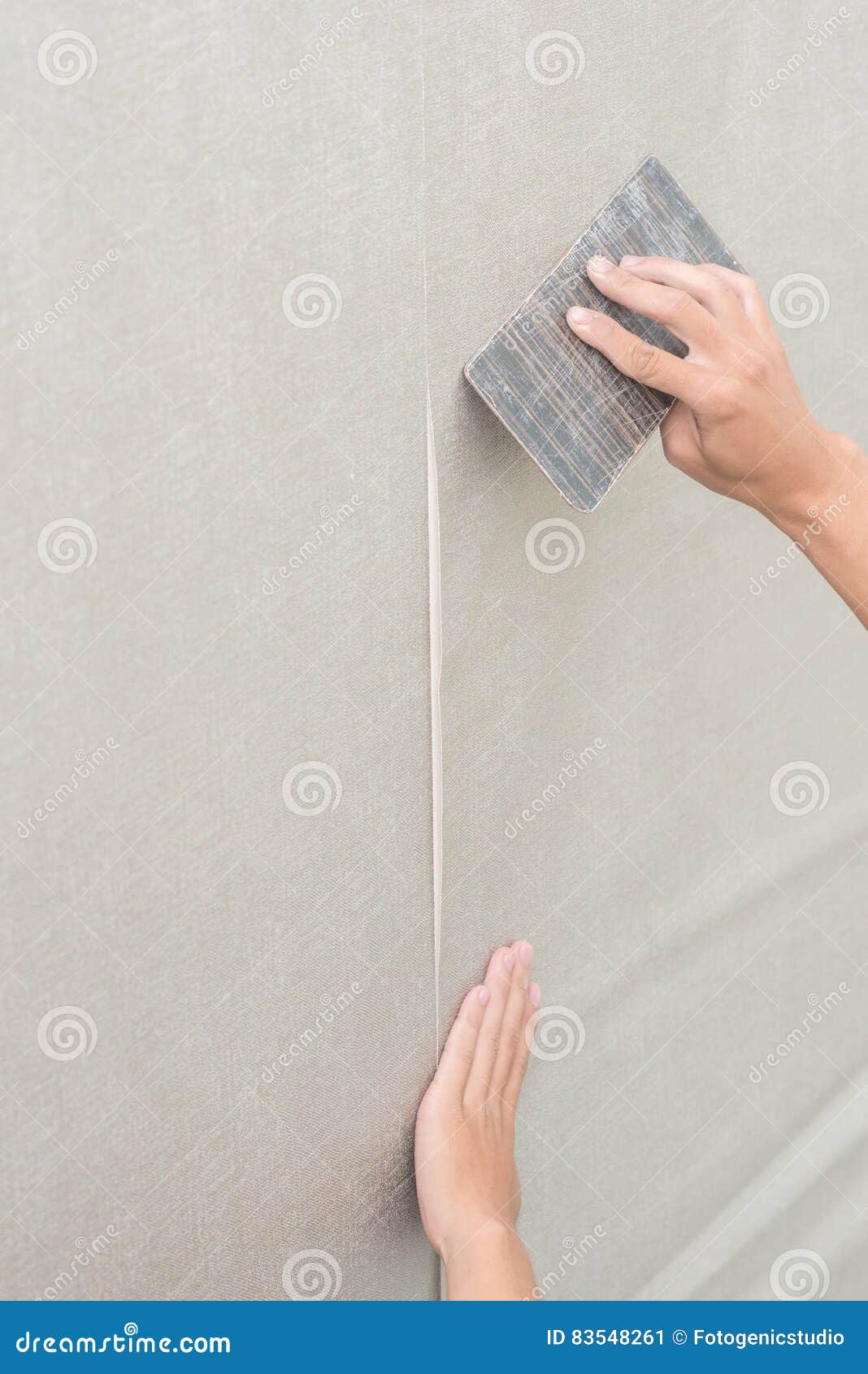 Handyman Putting Up Wallpaper on the White Walls Stock Image Image of