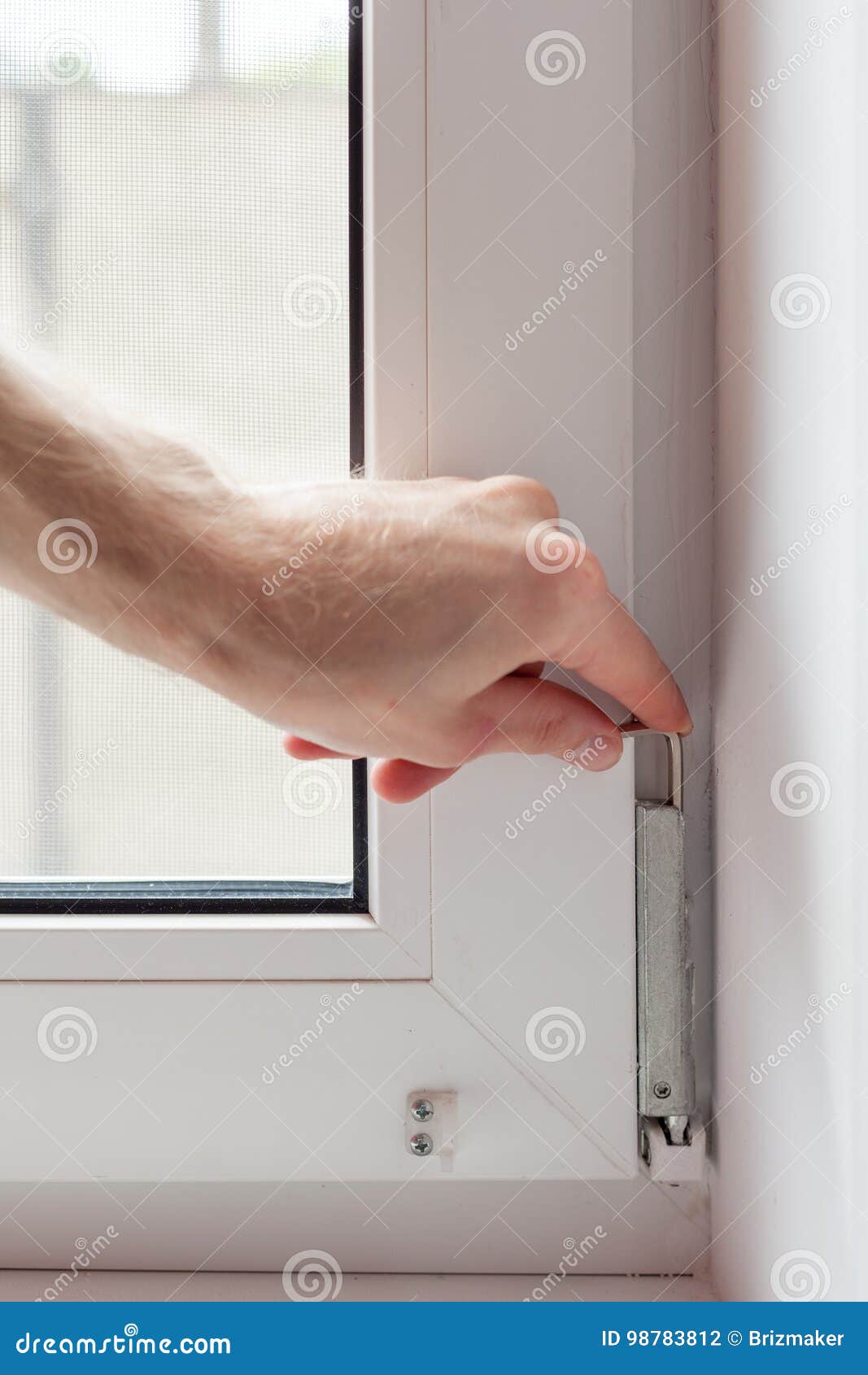 Handyman Repairs Plastic Window with a Hexagon. Workman Adjusts the