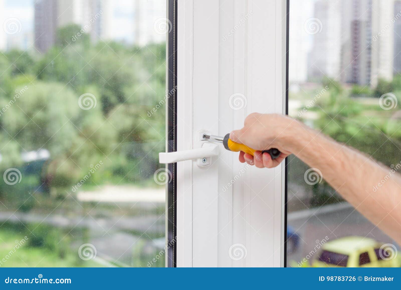 Handyman Repairs Plastic Window with Screwdriver Stock Photo Image of
