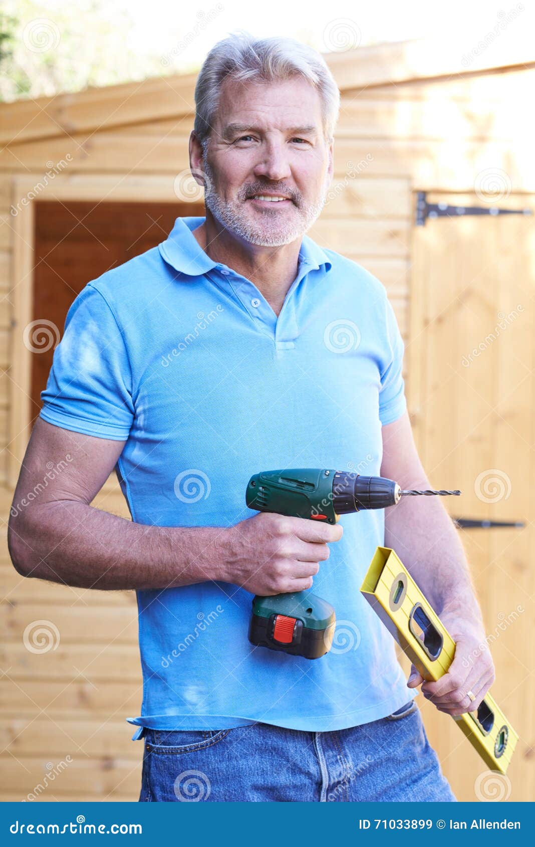 Handyman Standing Outside Garden Shed with Tools Stock Image Image of