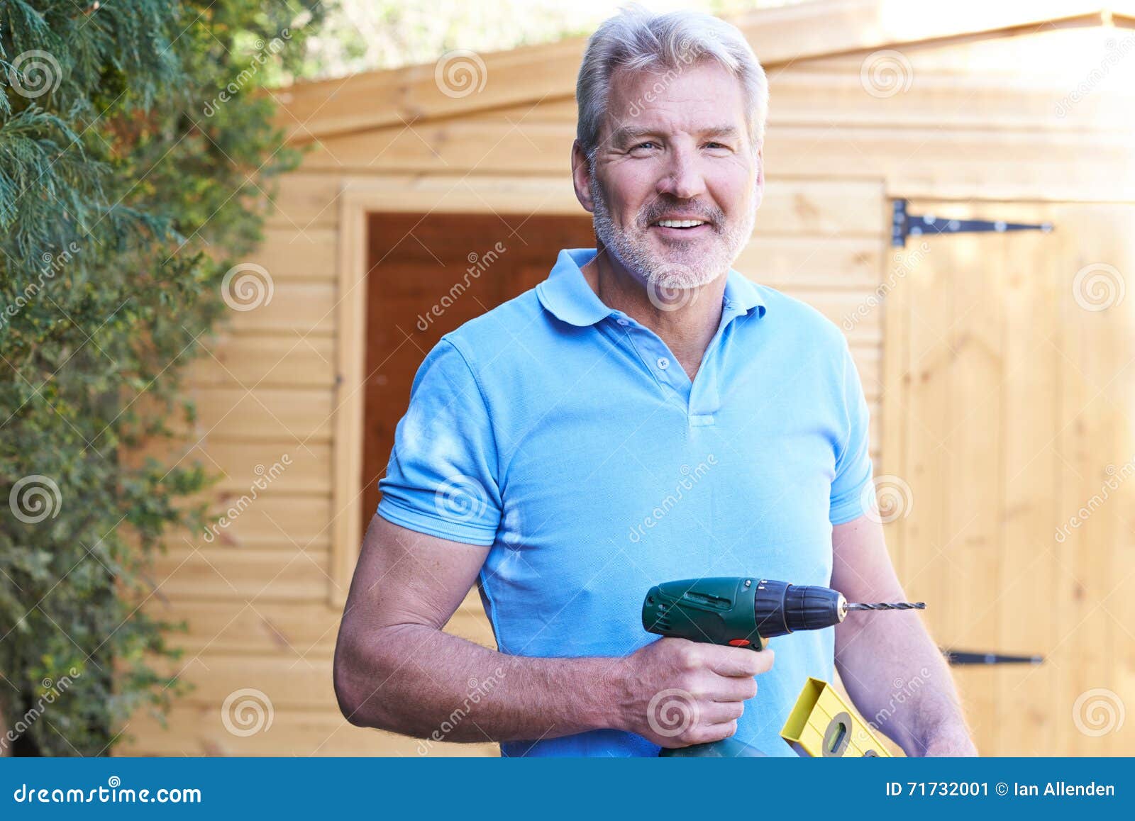 Handyman Standing Outside Garden Shed with Tools Stock Image Image of