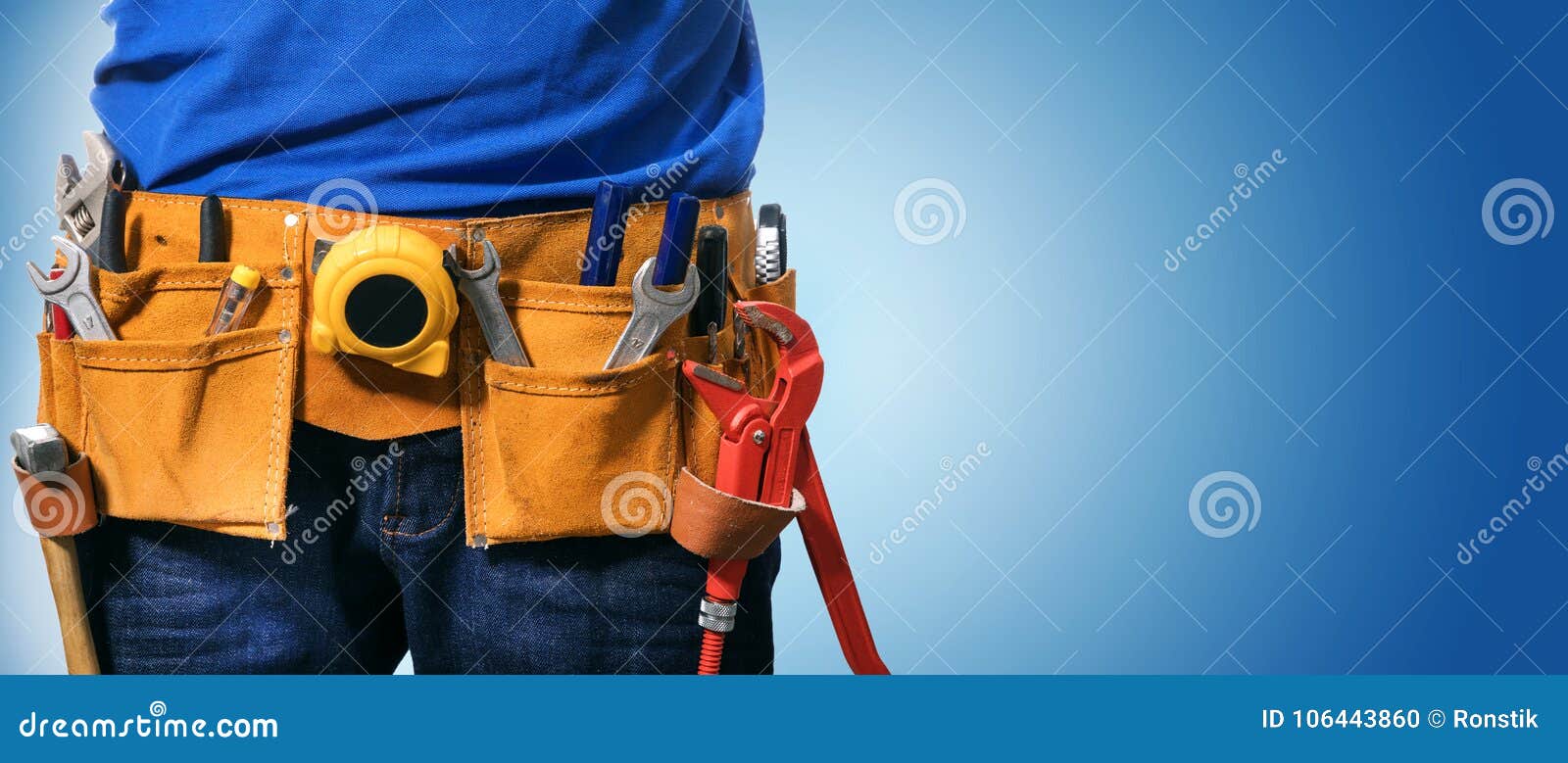 handyman tool belt on blue background with copy space