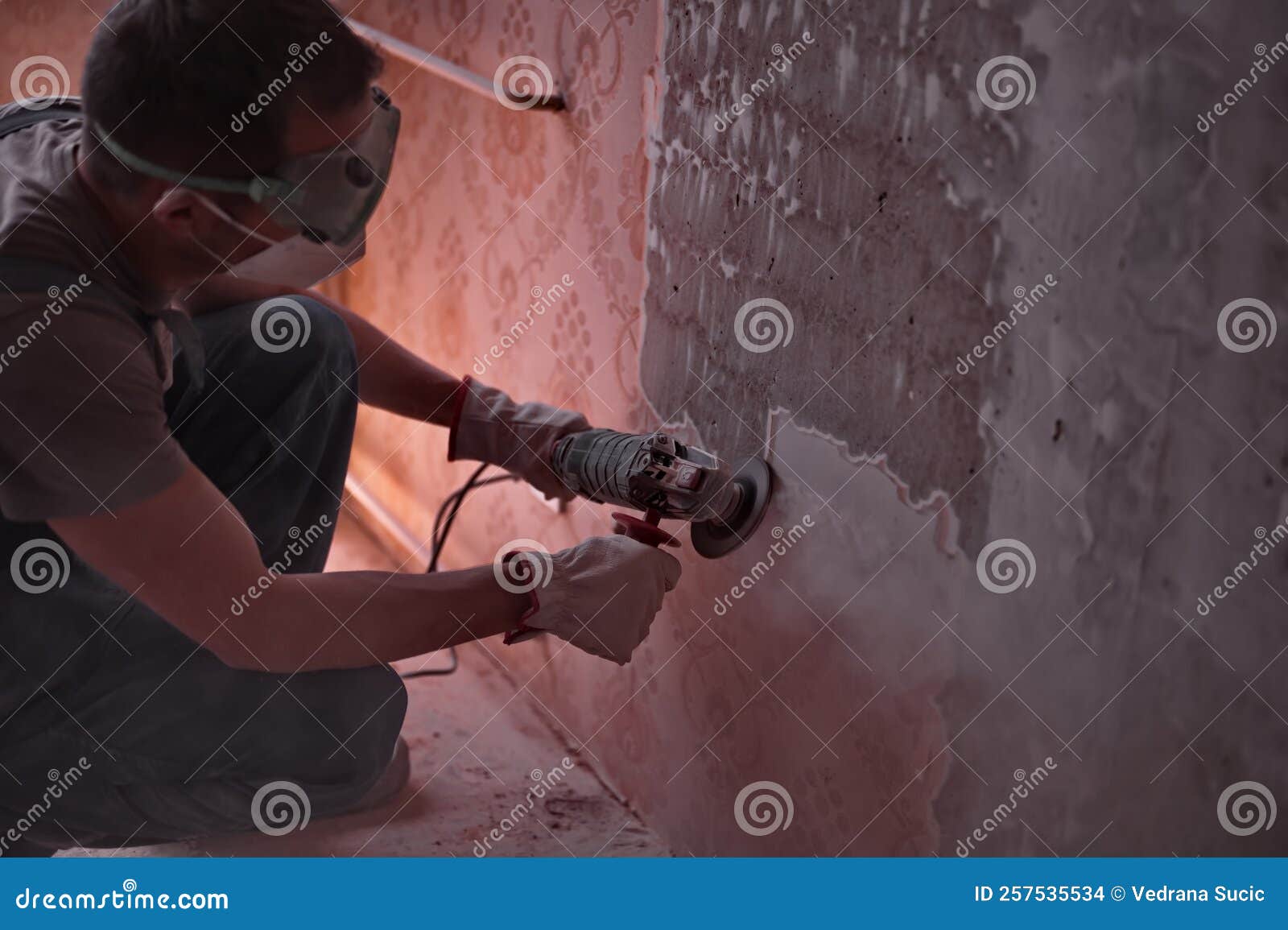 Handyman Using a Grinder To Remove Wallpaper Stock Photo Image of