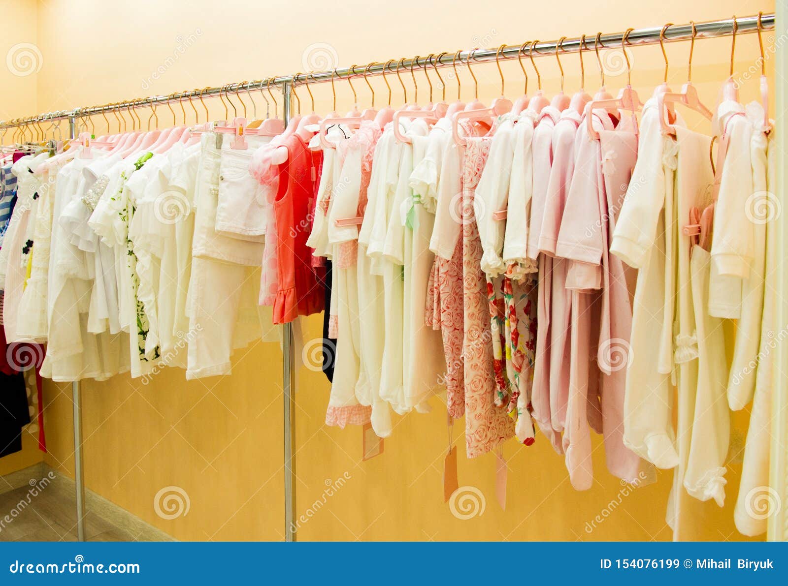 Hanger With Children`s Clothes, Background For Children`s Store Stock ...