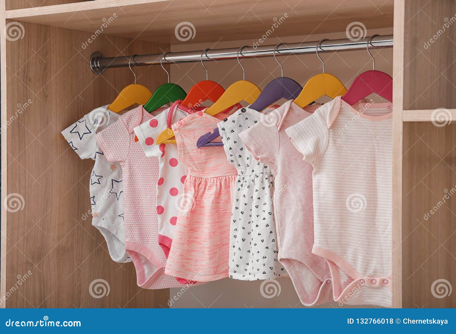 Hangers with Baby Clothes on Rack Stock Photo - Image of garments, inside:  132793586