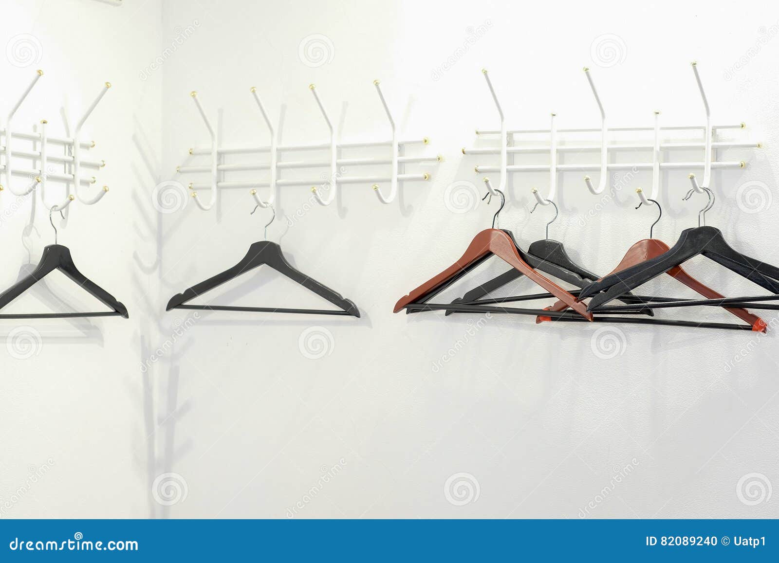 Hangers in a cloakroom stock photo. Image of table, fashion 82089240