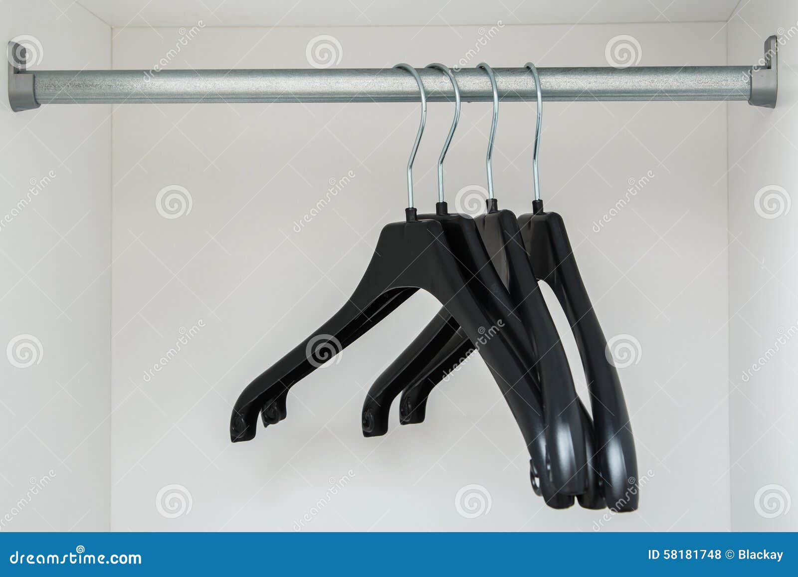 Hangers in the closet stock photo. Image of equipment 58181748