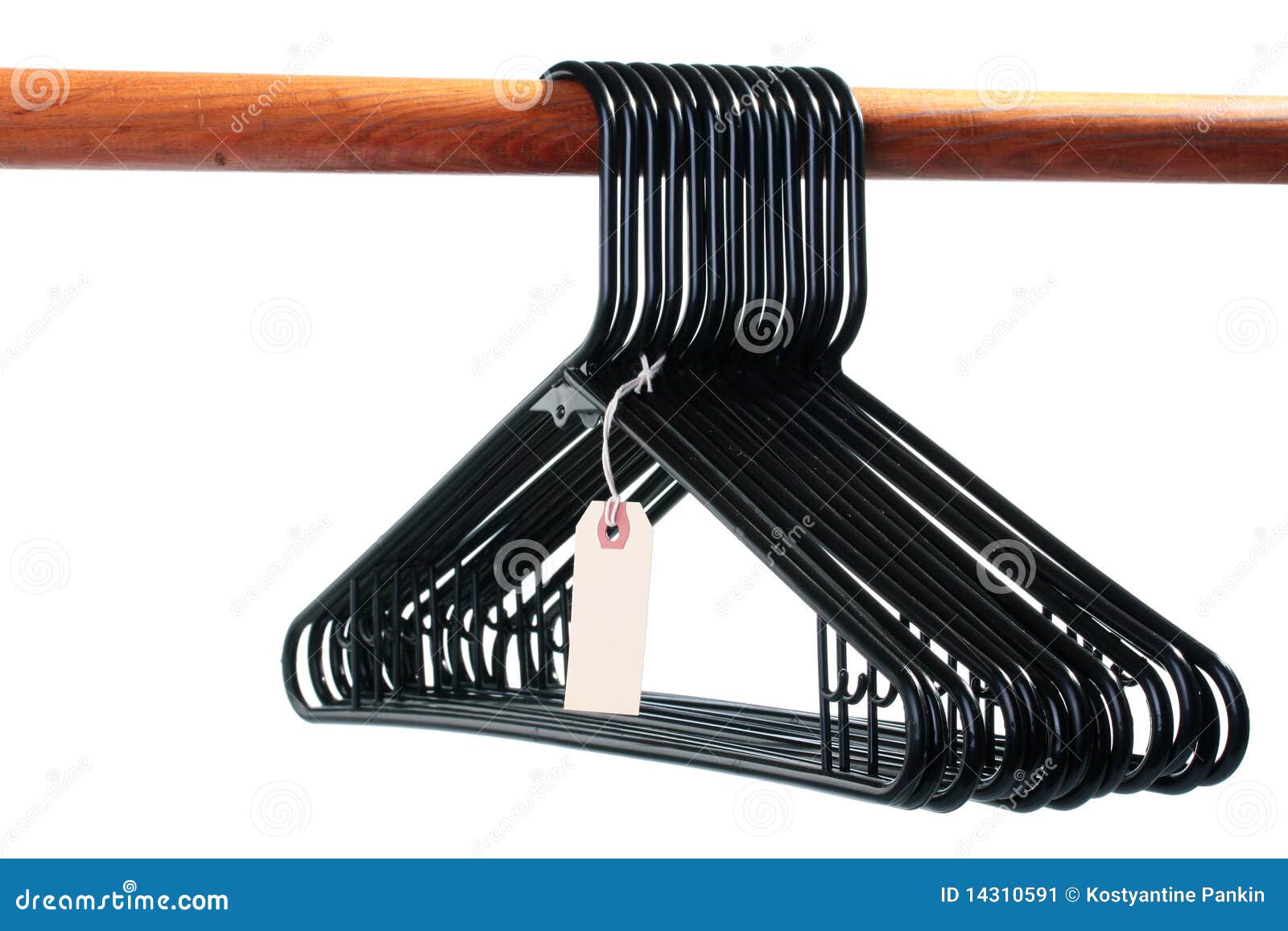 Black hangers for clothes on a wooden crossbeam with a label on a white background.