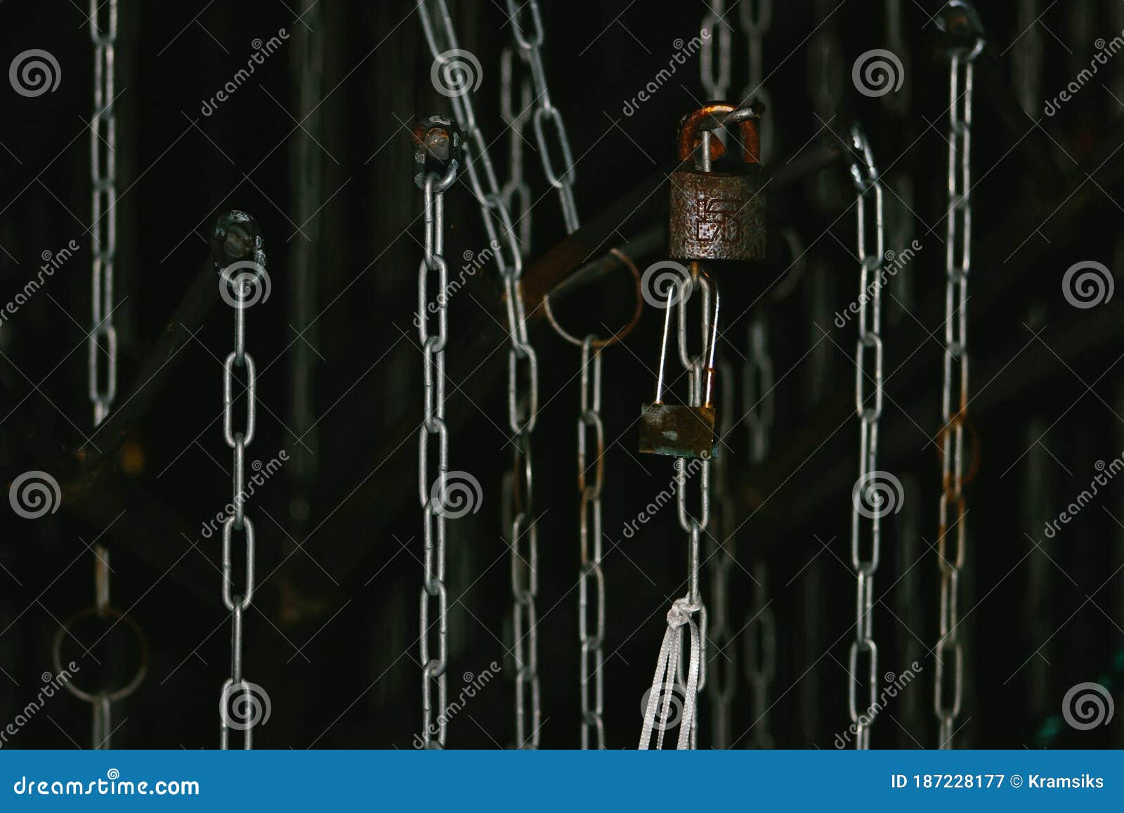 Hanging Chains and Locks on the Dark Background Editorial Photography