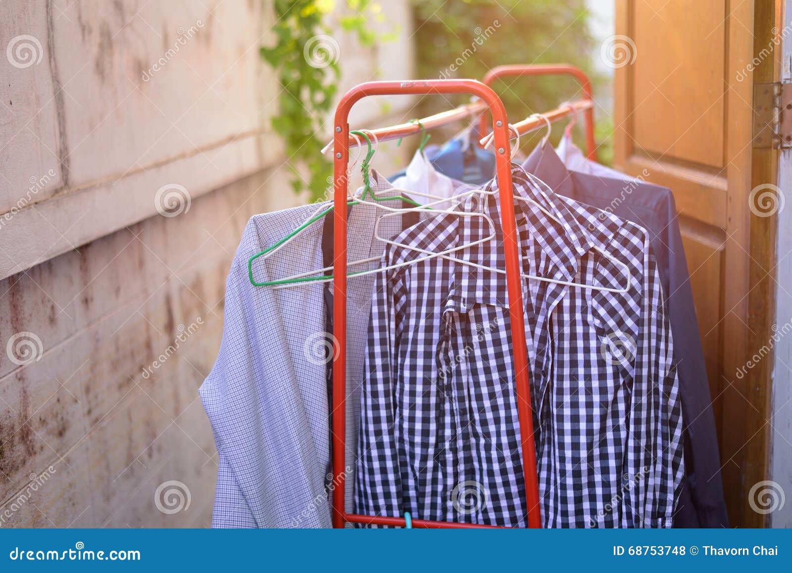 Hanging dry the clothes stock photo. Image of coat, clothes 68753748