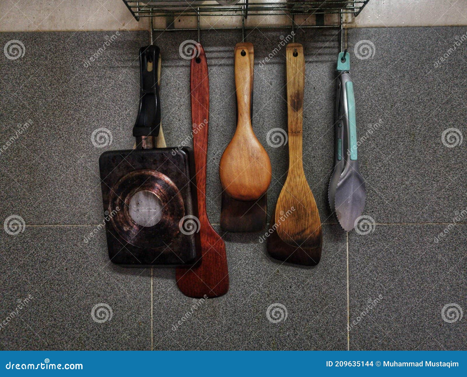 Hanging Kitchen Utensils on a Grey Wall Stock Photo Image of table