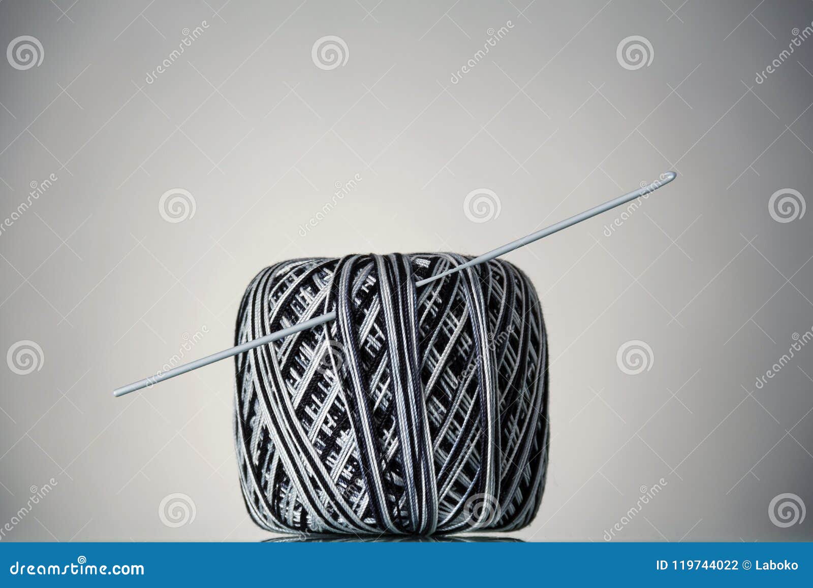 Hank of Black and White Yarn and Crochet Hook, on Grey Stock Photo - Image  of soft, fiber: 119744022