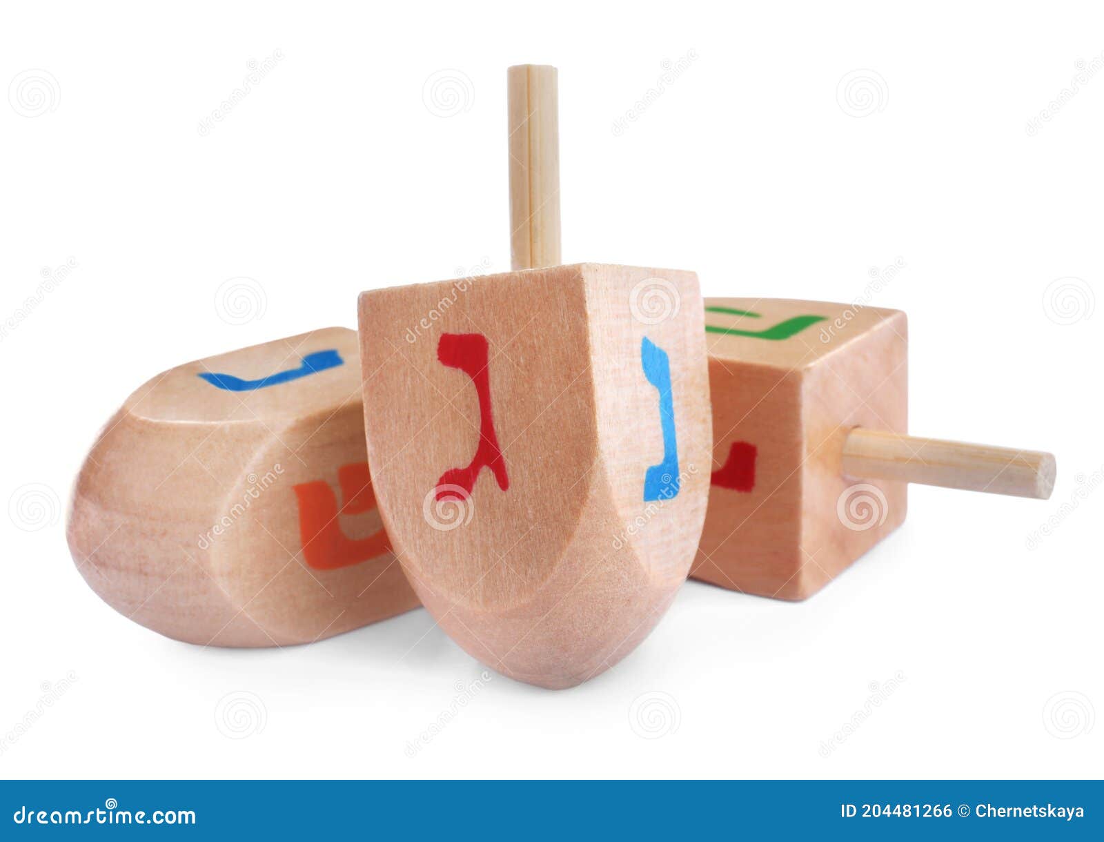 wooden hanukkah traditional dreidels on white background