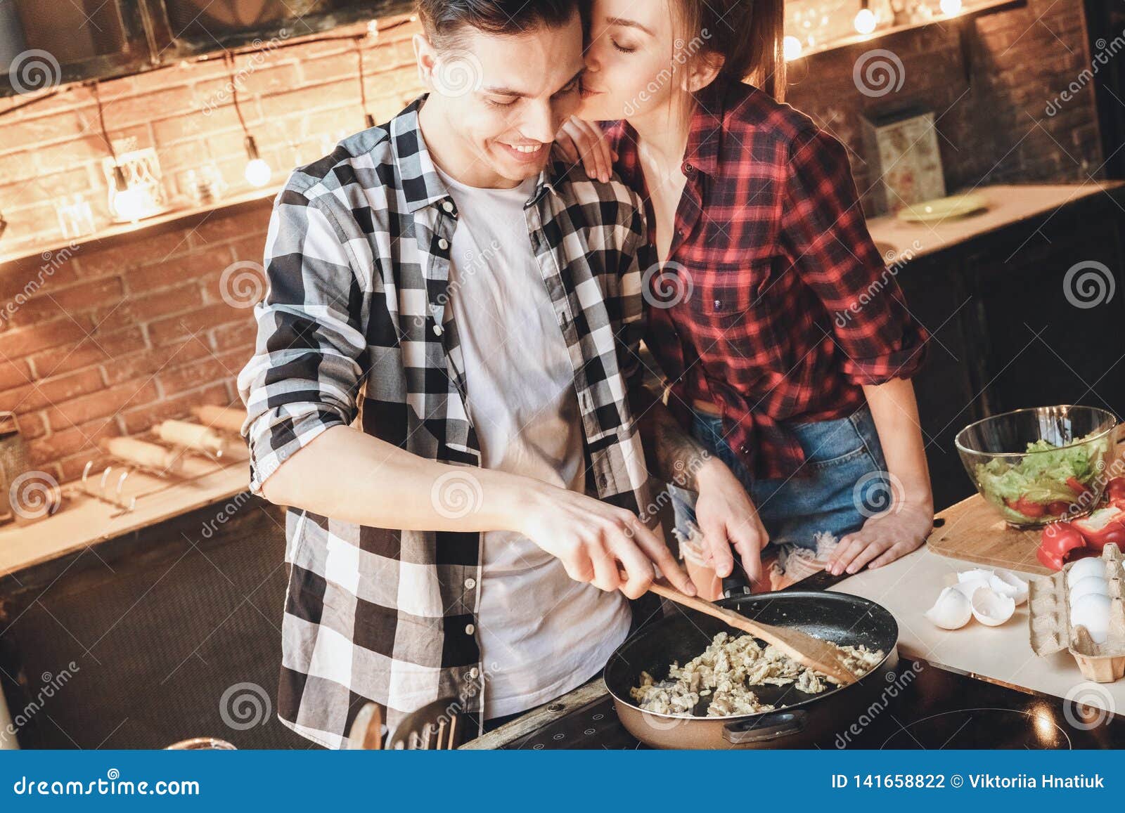 Happiness Husband Making Dinner When Perfect Wife Kissed Him Stock