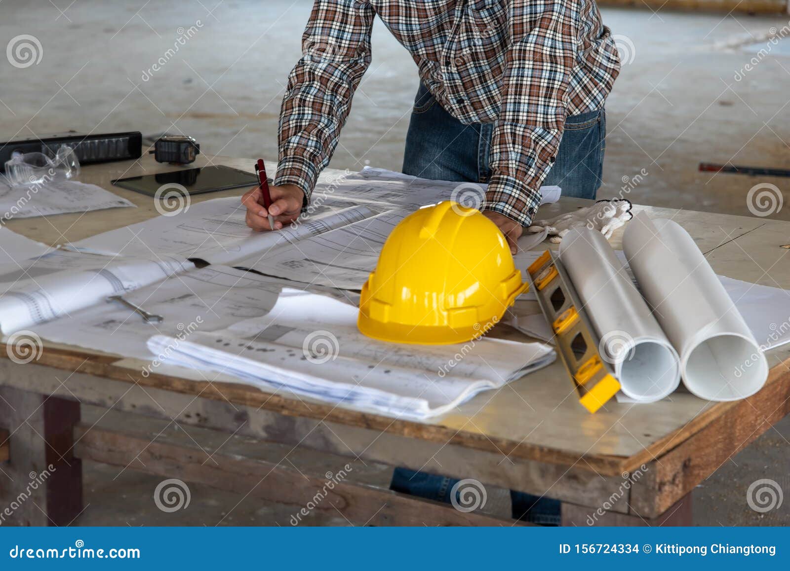 happiness smile professional businessman consulting with engineering/ architecture in construction renovate building site.