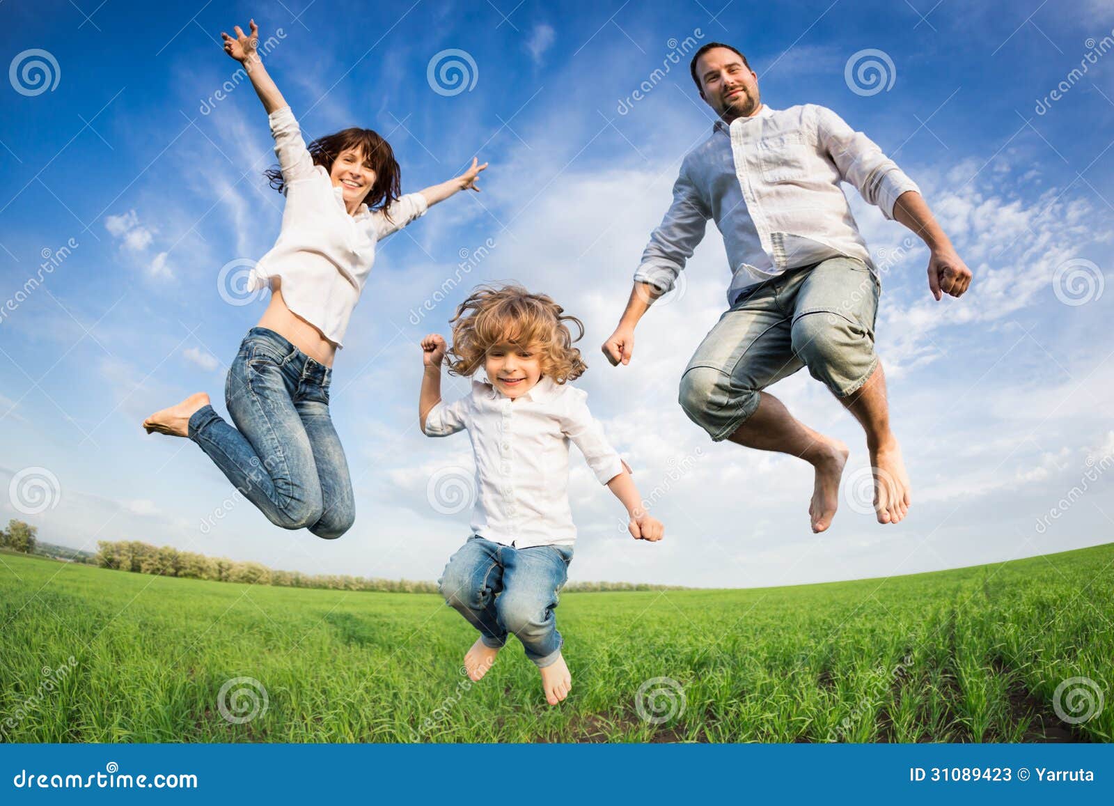 happy active family jumping