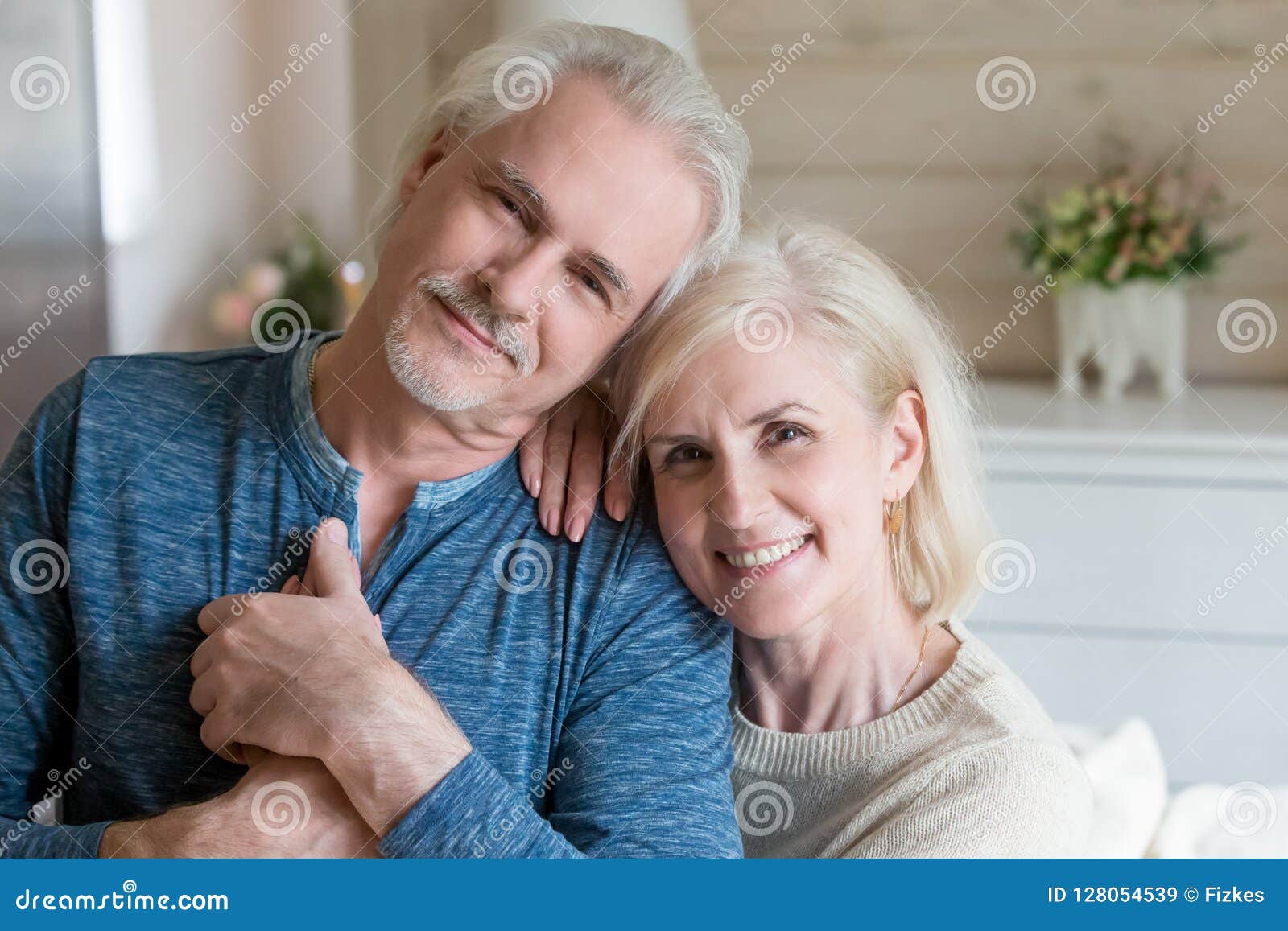 Happy Affectionate Mature Man And Woman Embracing Looking At Cam Stock Image Image Of Camera