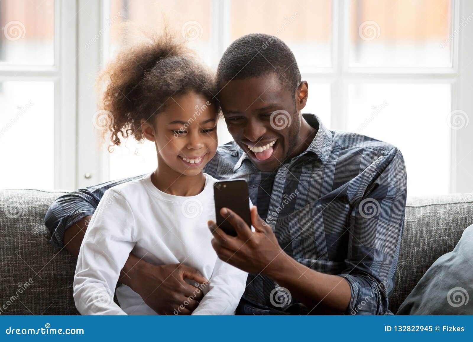 Hooked on Phone. Family Play Mobile Phone Game at Home. Staying Connected  with Cell Phone. Family Communication Stock Photo - Image of beard, baby:  180857330