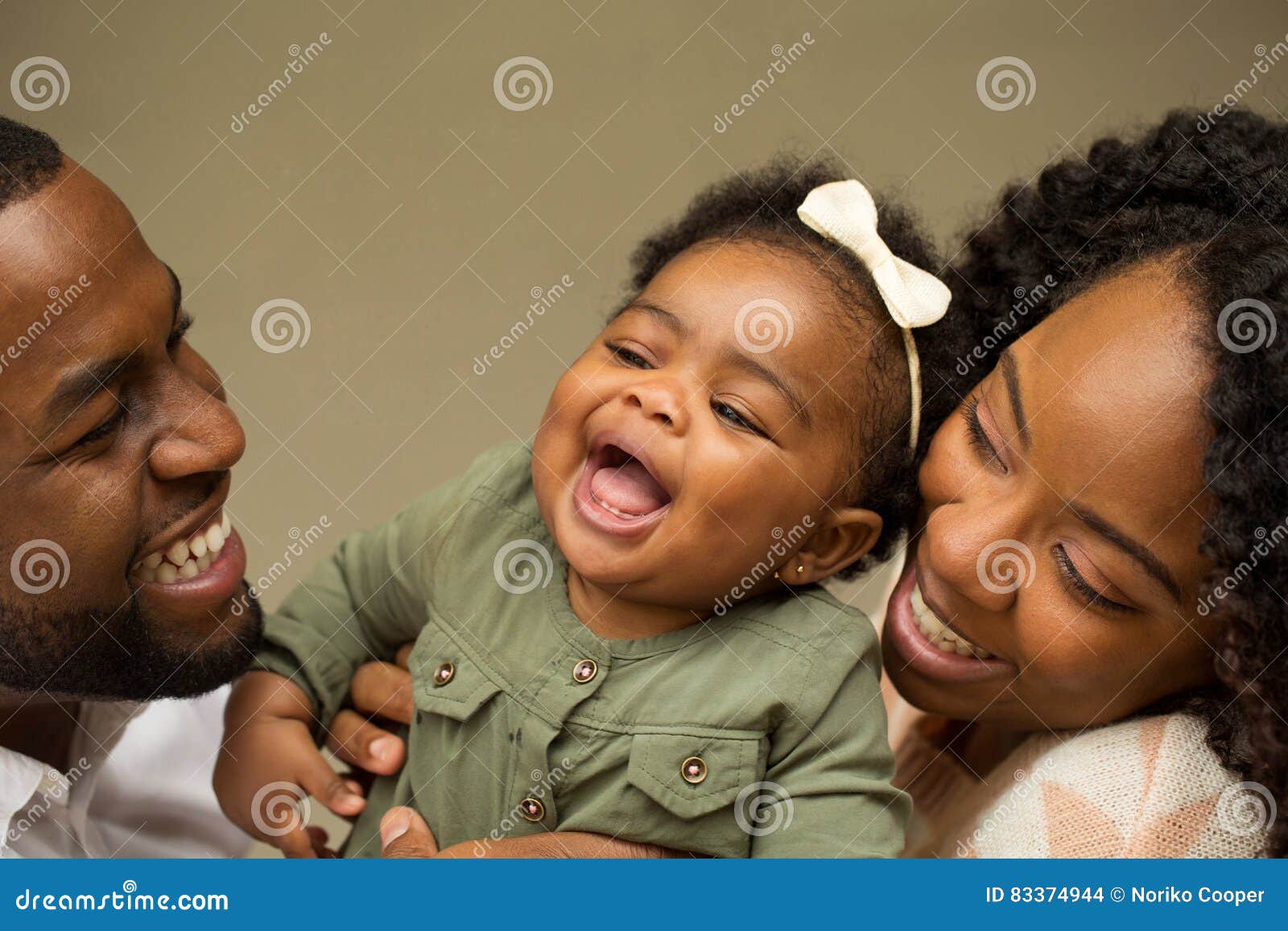 happy african american family with their baby.