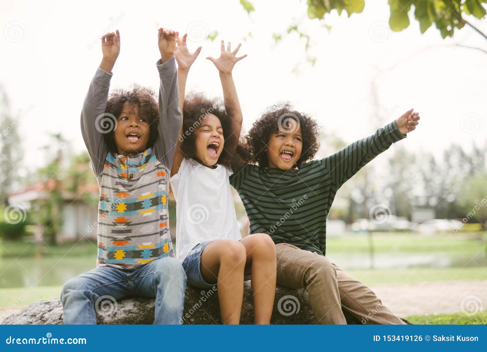 happy african american little boy kids children joyfully cheerful and laughing. concept of happiness.