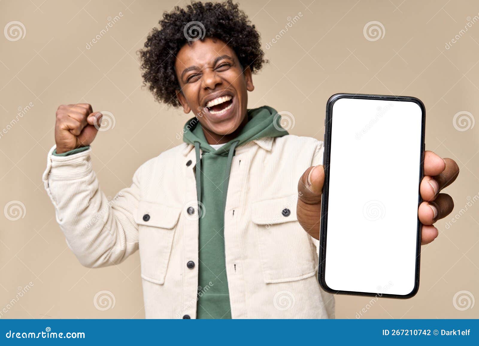 happy african american winner showing big mock up mobile phone screen.