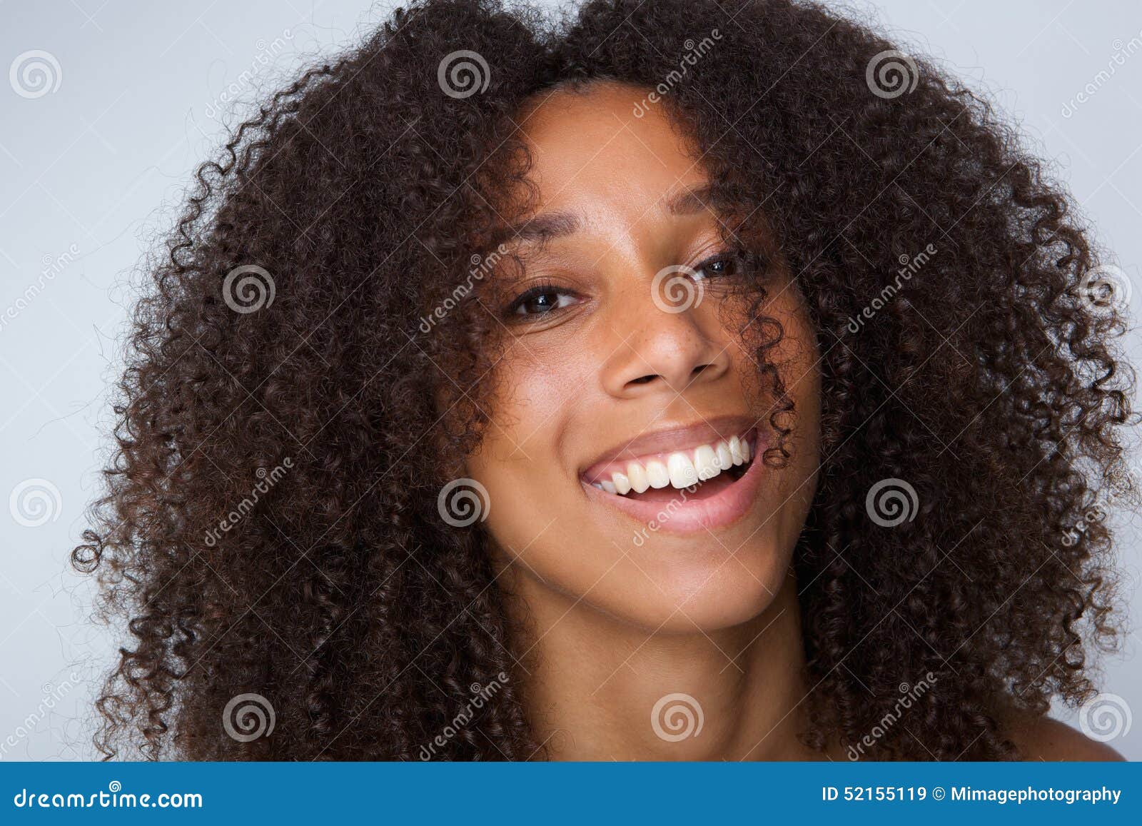 Happy African American Woman with Curly Hair Laughing Stock Image
