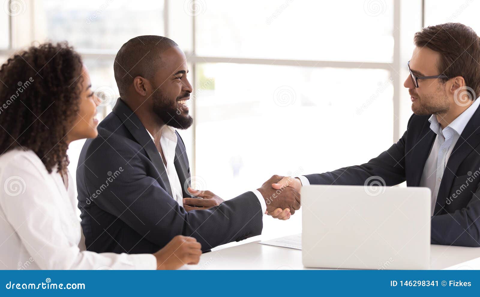 happy african couple shake hand of insurer buy insurance services