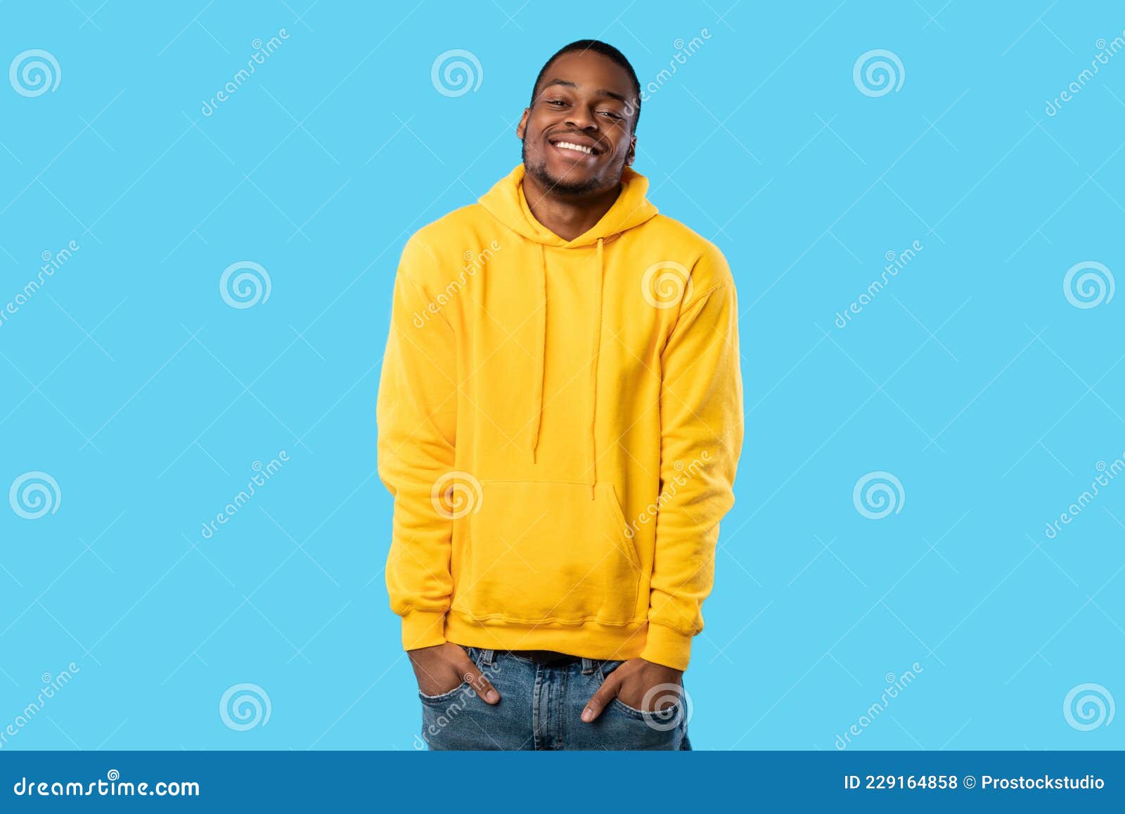 Happy African Guy Posing with Hands in Pockets, Blue Background Stock ...