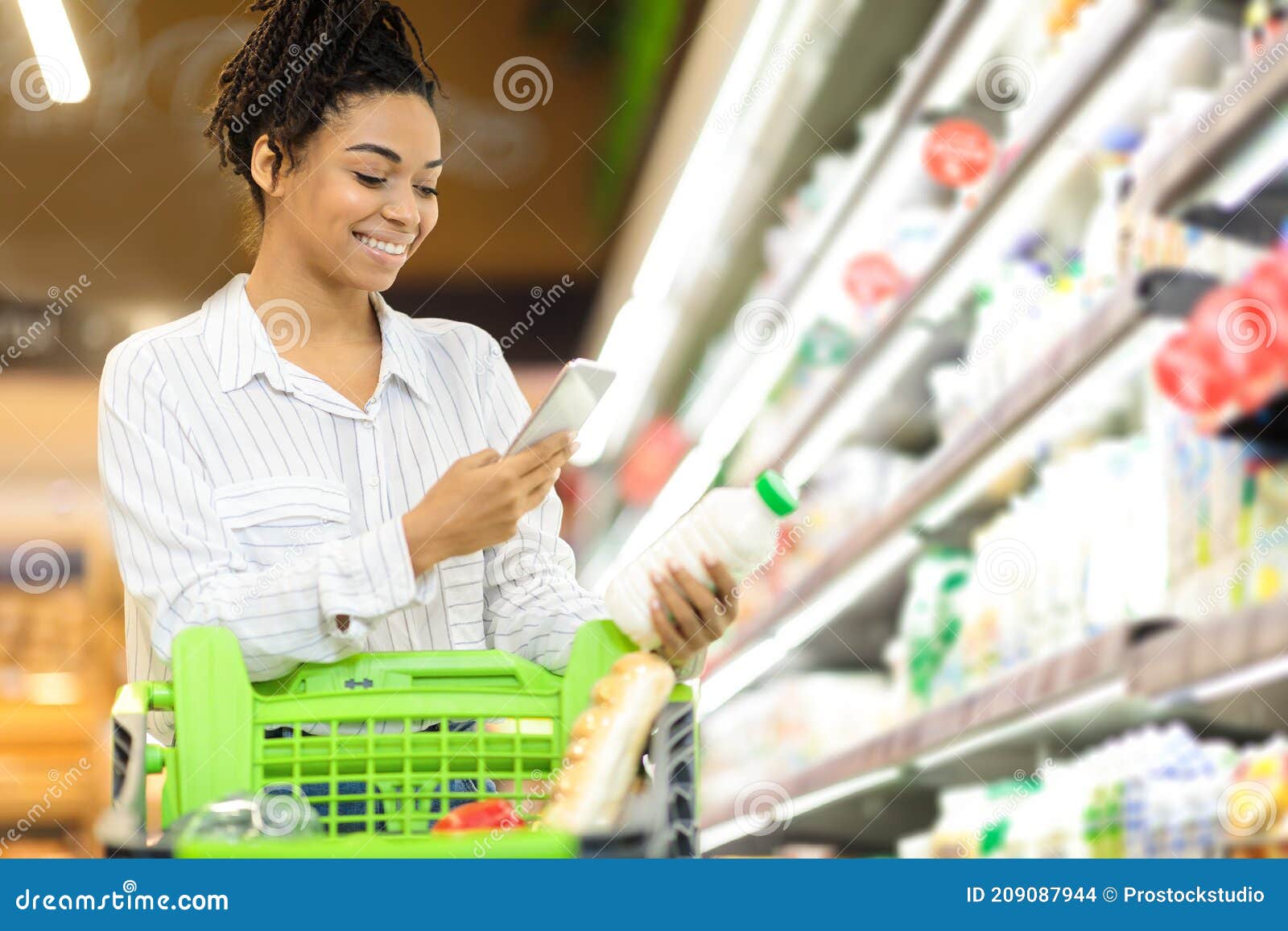 Happy African Lady Scanning Product on Grocery Shopping in Supermarket ...