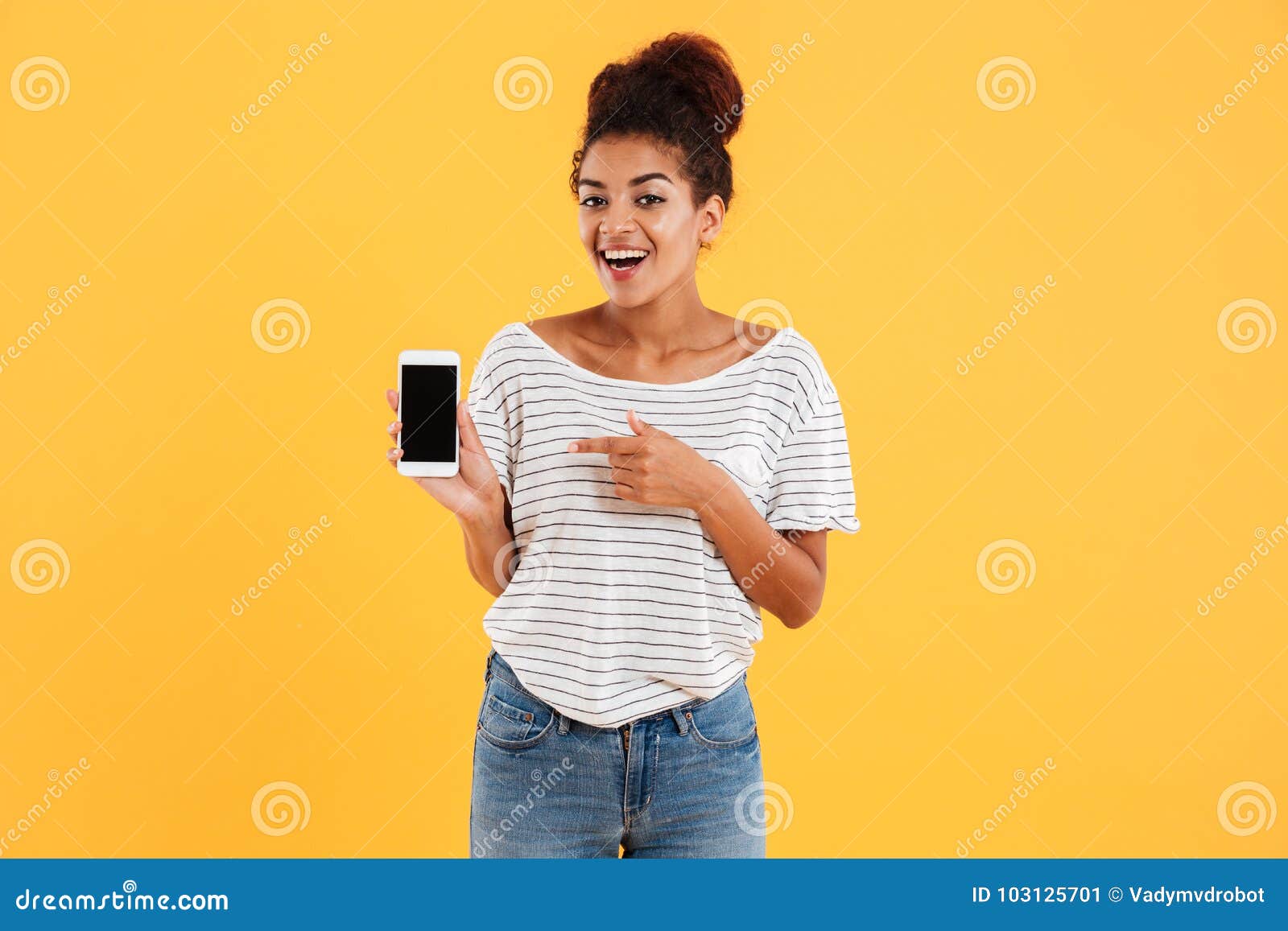 happy african lady showing smartphone with blank screen 