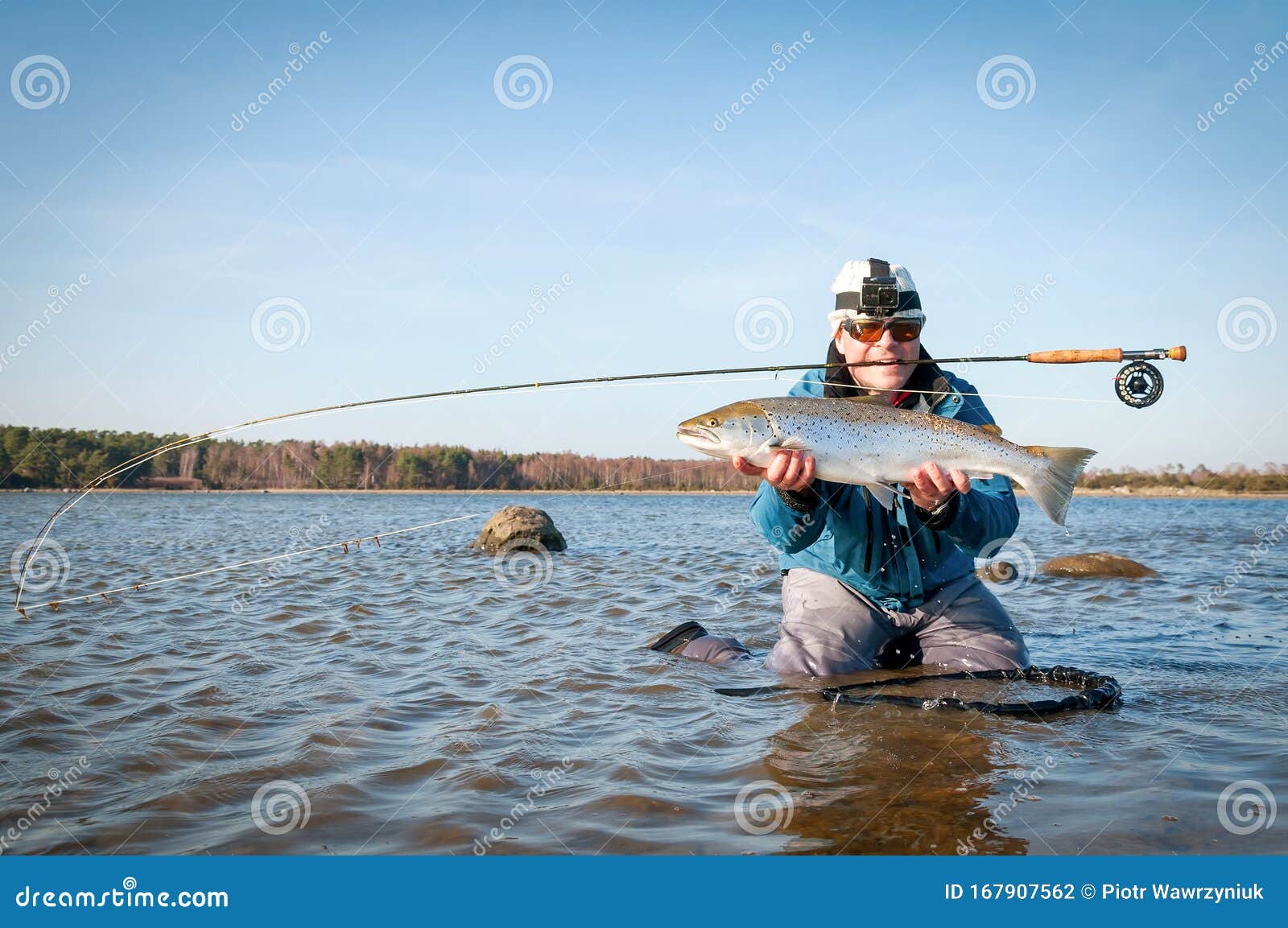 Happy Angler with Big Sea Trout Stock Photo - Image of coast, animal:  167907562