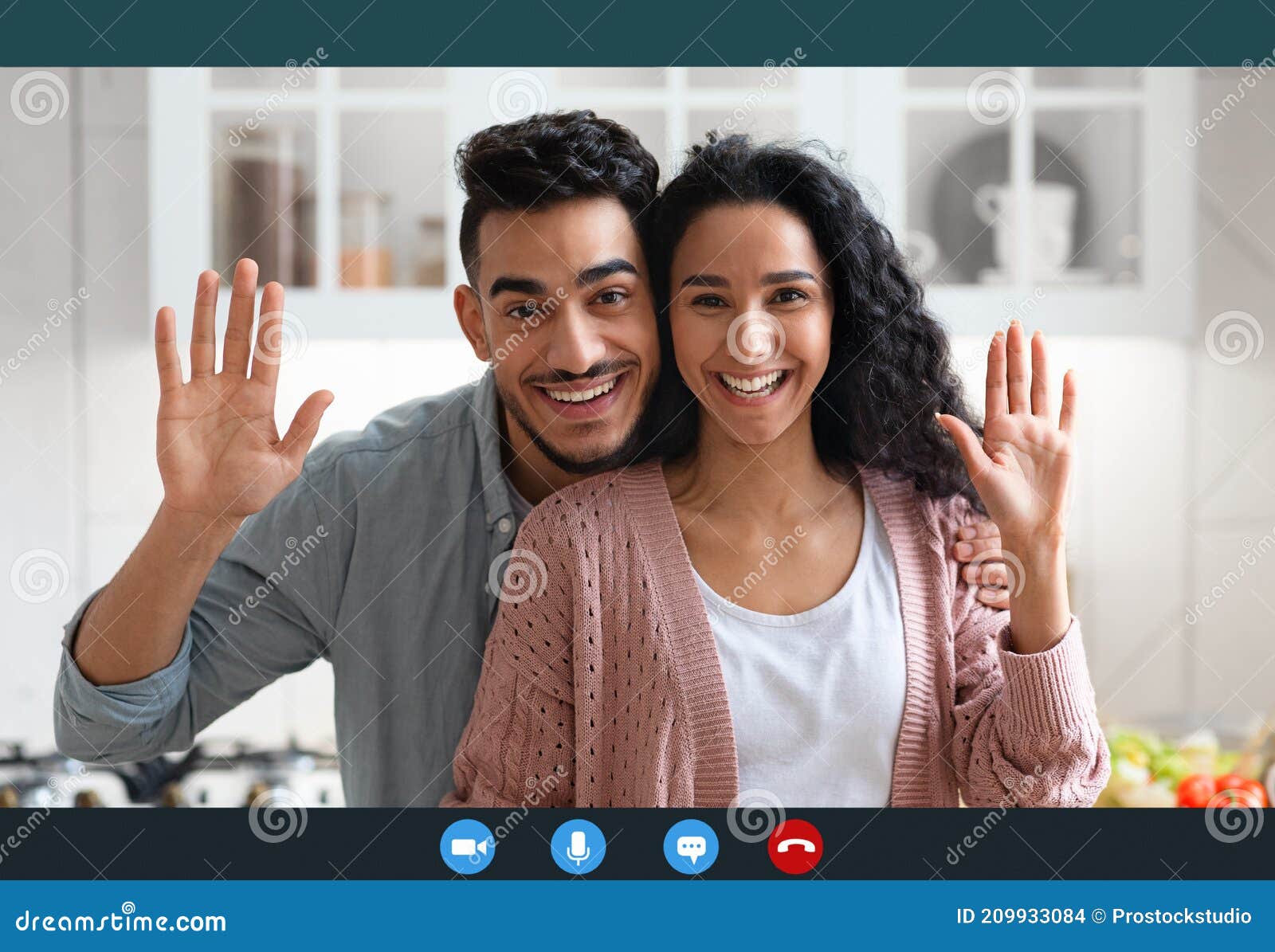 happy arab couple making video call with laptop in kitchen interior, screenshot