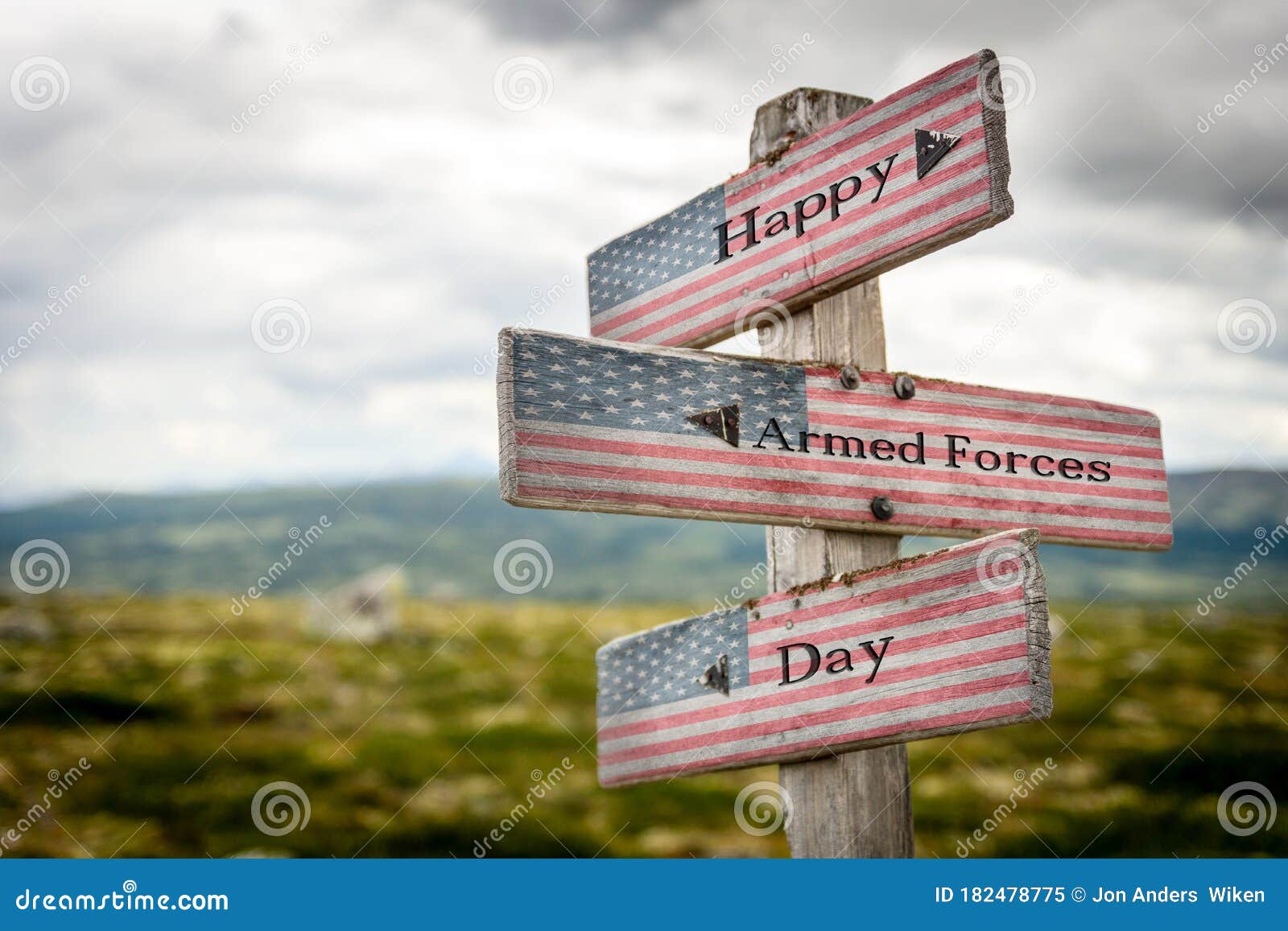happy armed forces day text on wooden american flag signpost outdoors