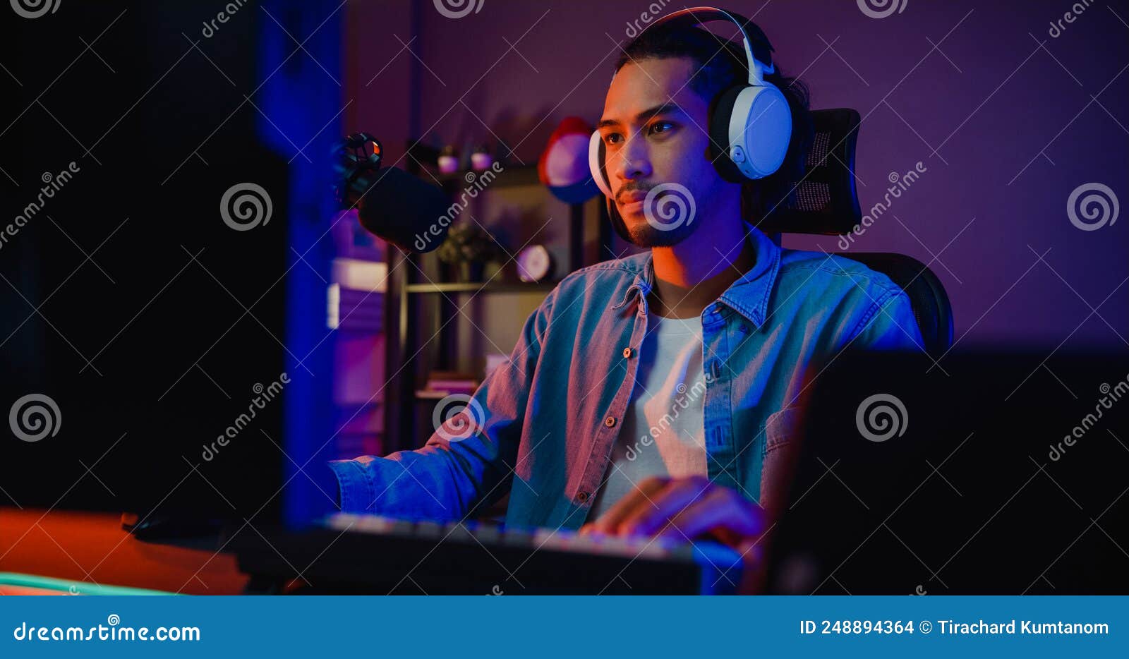 Happy Asia Girl Gamer Wear Headphone Competition Play Video Game Online  With Smartphone Colorful Neon Lights In Living Room At Home. Esport  Streaming Game Online, Home Quarantine Activity Concept. Stock Photo,  Picture