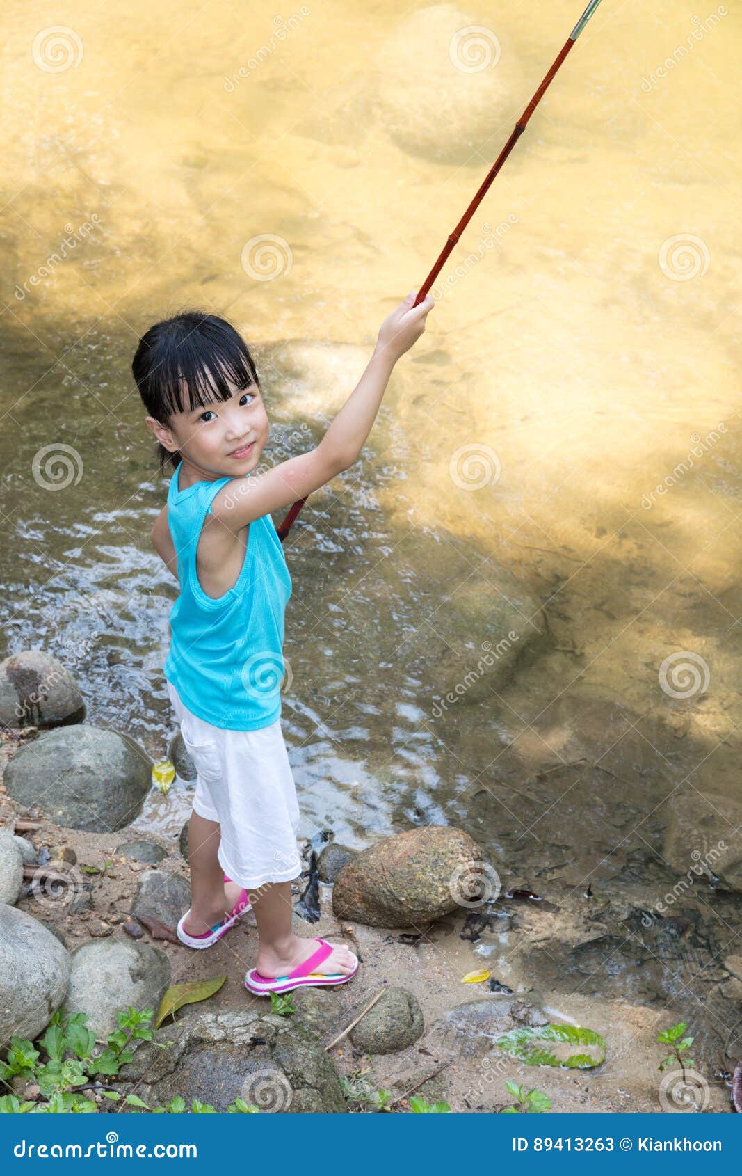 Happy Asian Chinese Little Girl Angling with Fishing Rod Stock