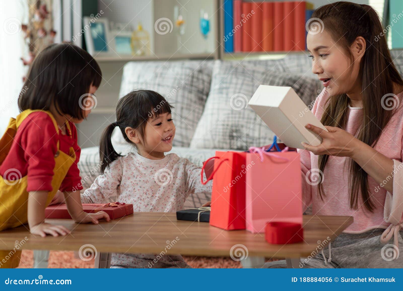 Happy Asian Family Children Giving a Present for Mom, Gift Box and Shopping  Bags, Christmas and New Year Kid Stock Photo - Image of happiness,  greeting: 188884056