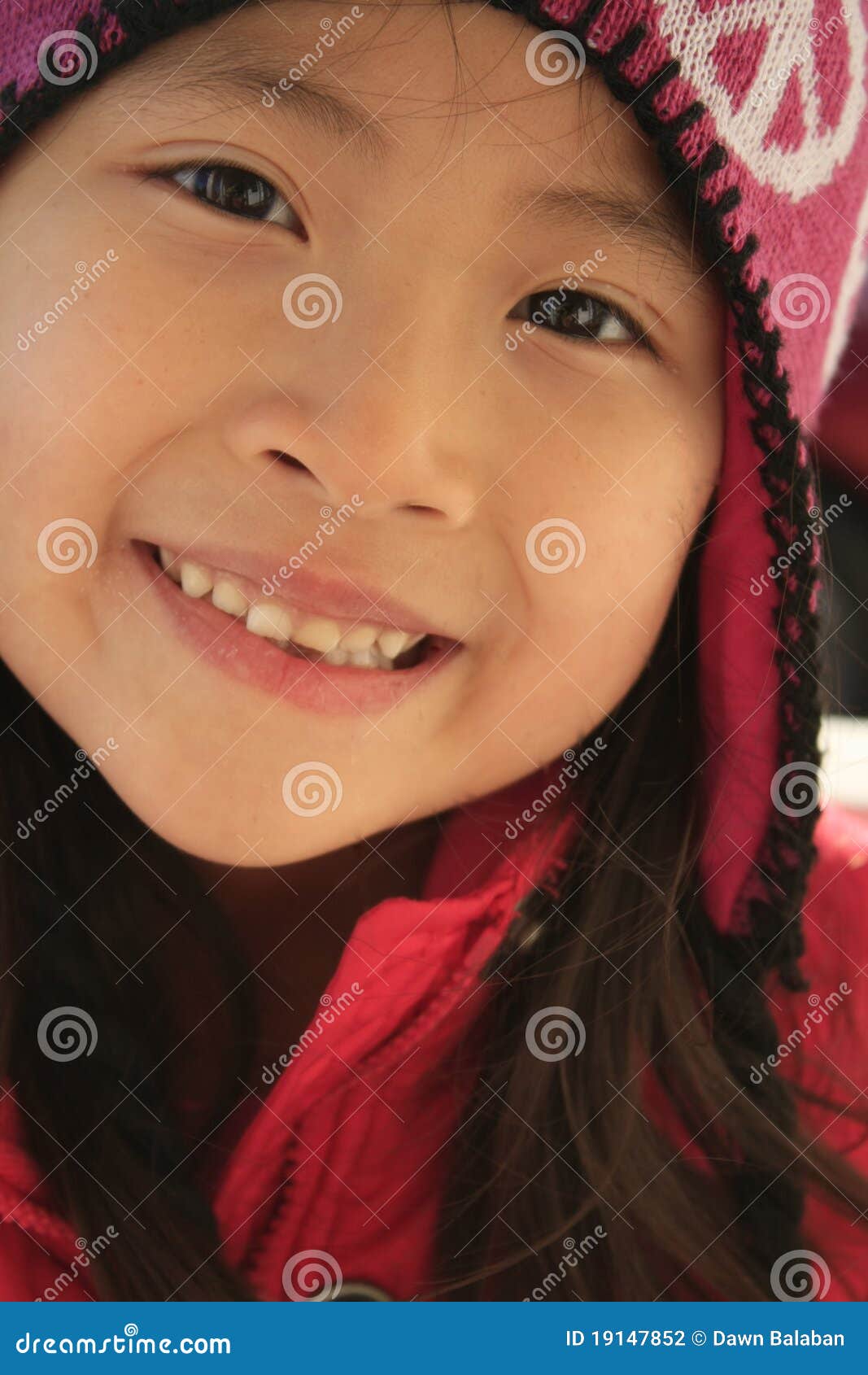 happy asian girl in wintry hat