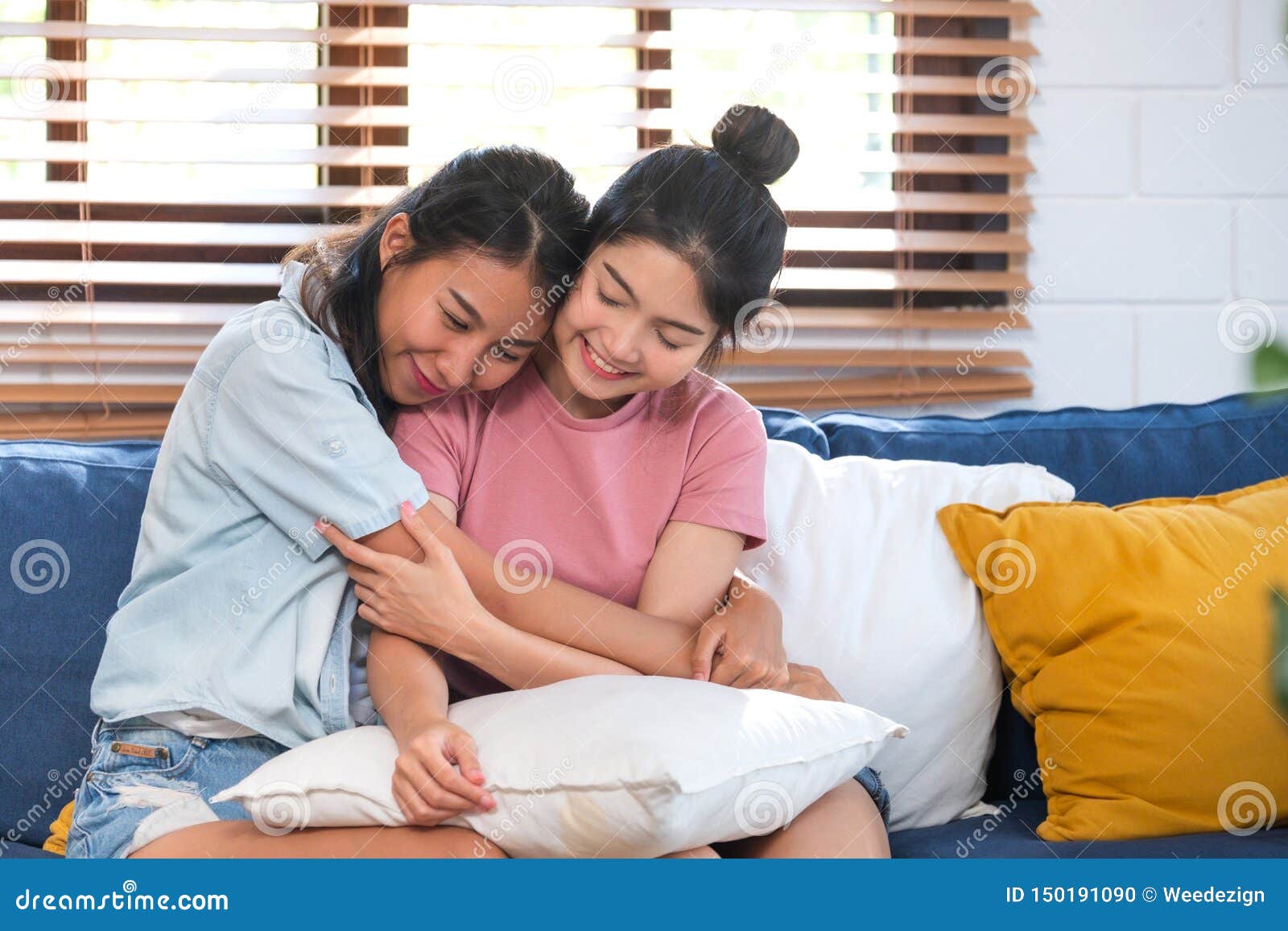 Happy Asian Lesbian Couple Hug Each Other With Love On Sofa At Living Room At Homelgbtq