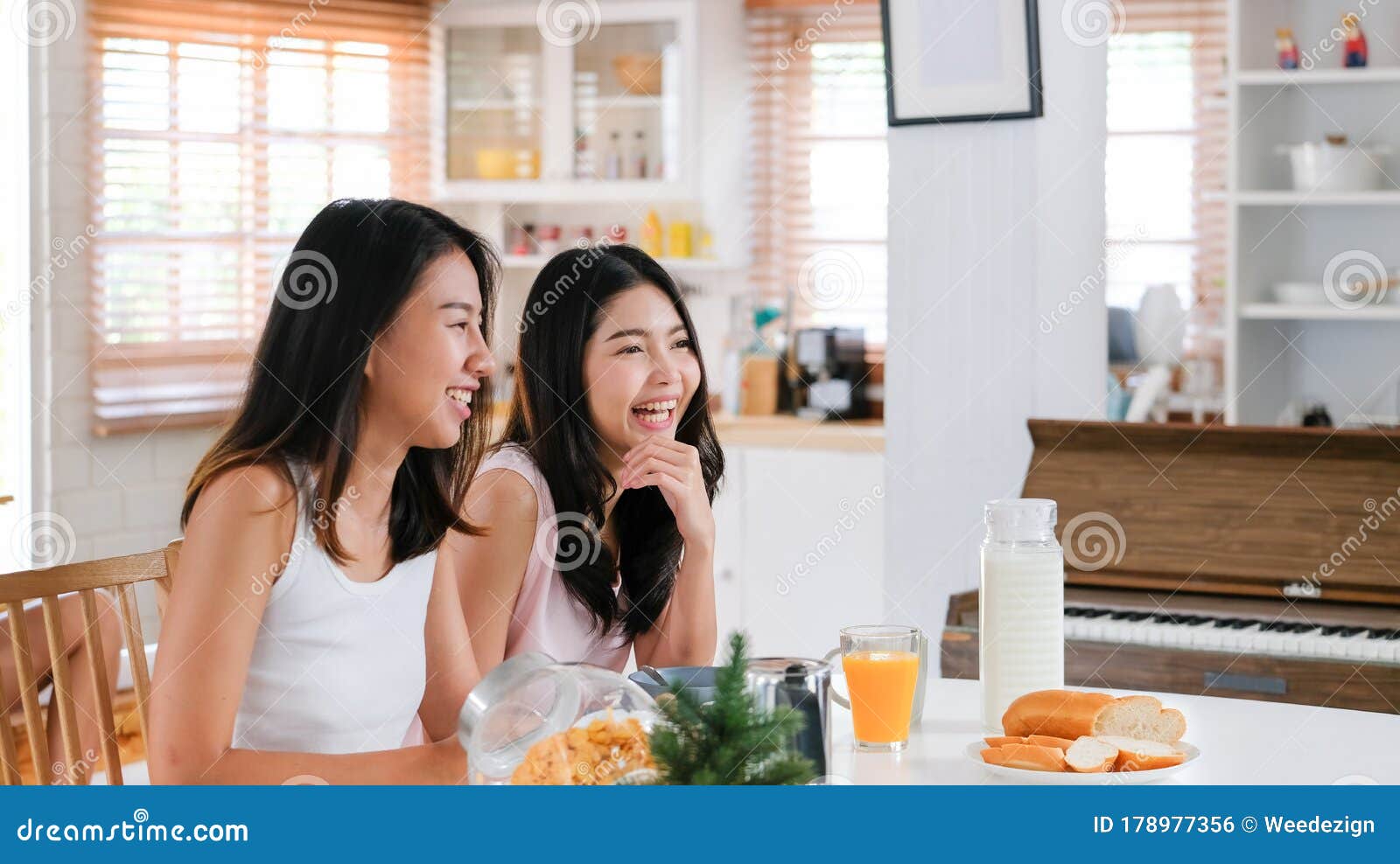 Happy Asian Lesbian Woman Couple Have Breakfast At House