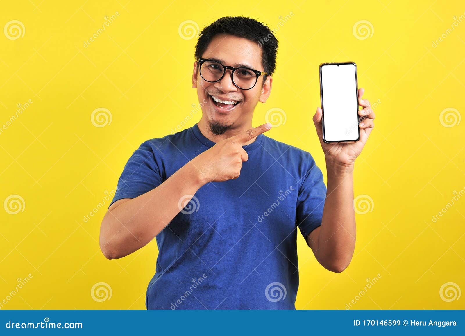 happy asian man showing a phone screen and pointing