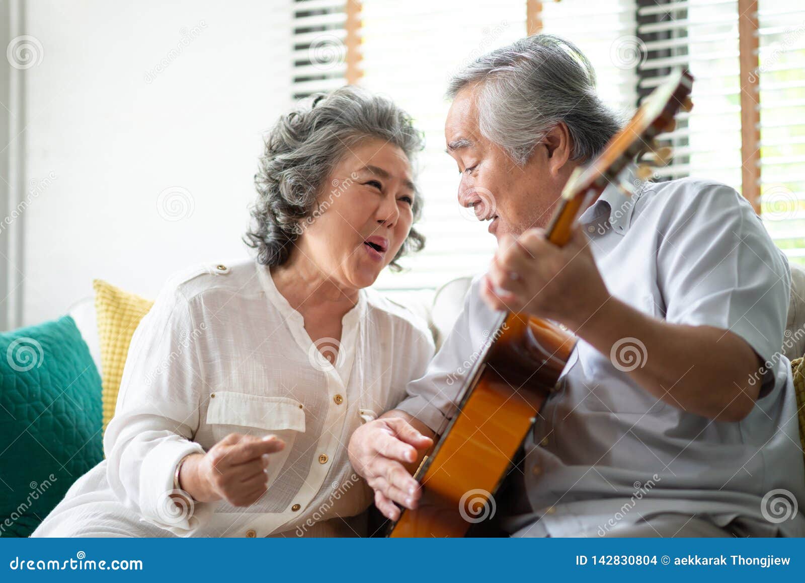 happy asian senior couple enjoying