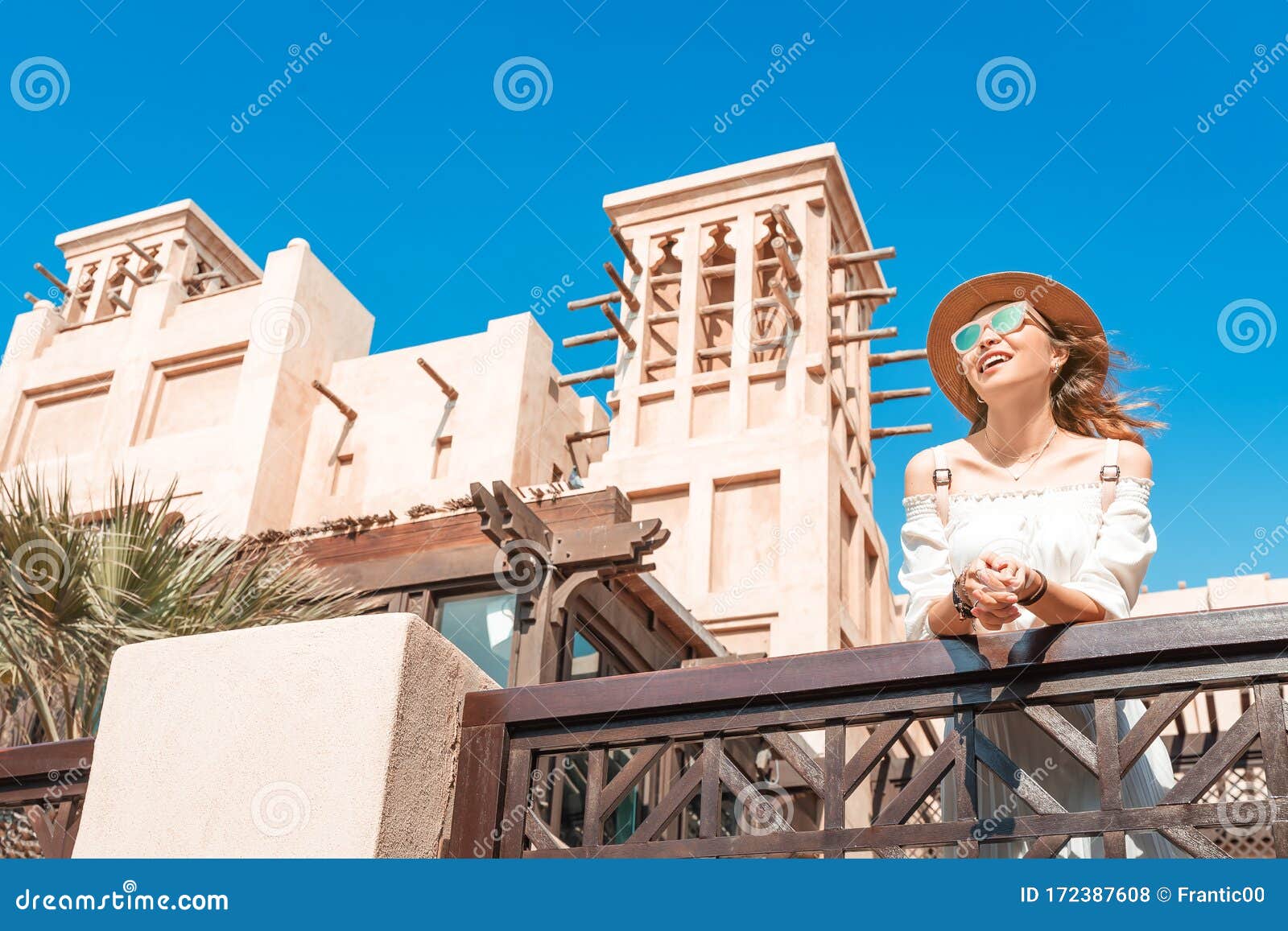 asian tourist girl walks through the old arab city in dubai, united arab emirates