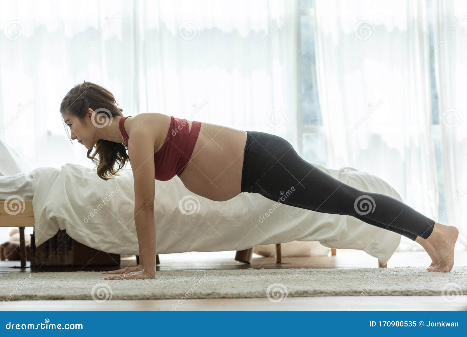 Happy Attractive Asian Pregnant Woman Practice Yoga Plank Or