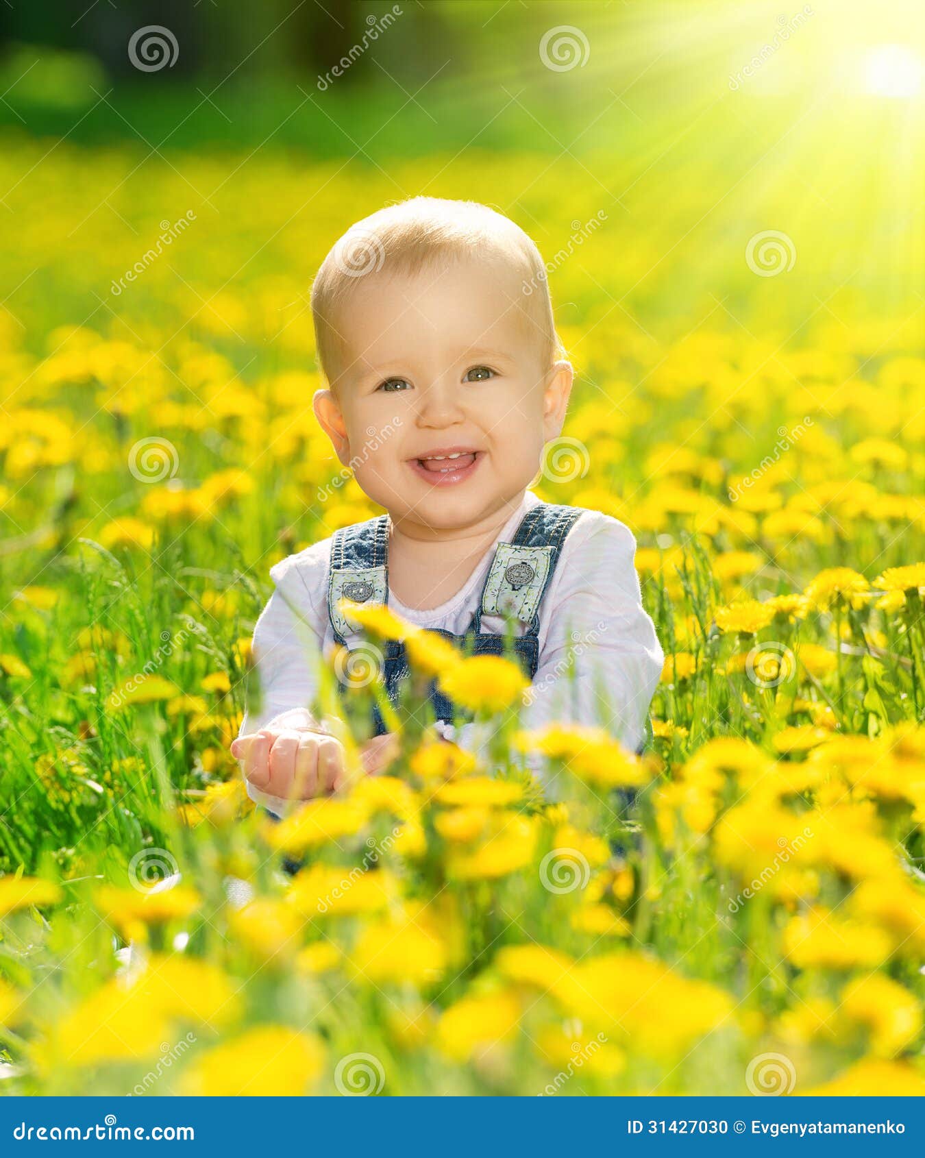 Happy Baby Girl On Meadow With Yellow Flowers On Stock ...