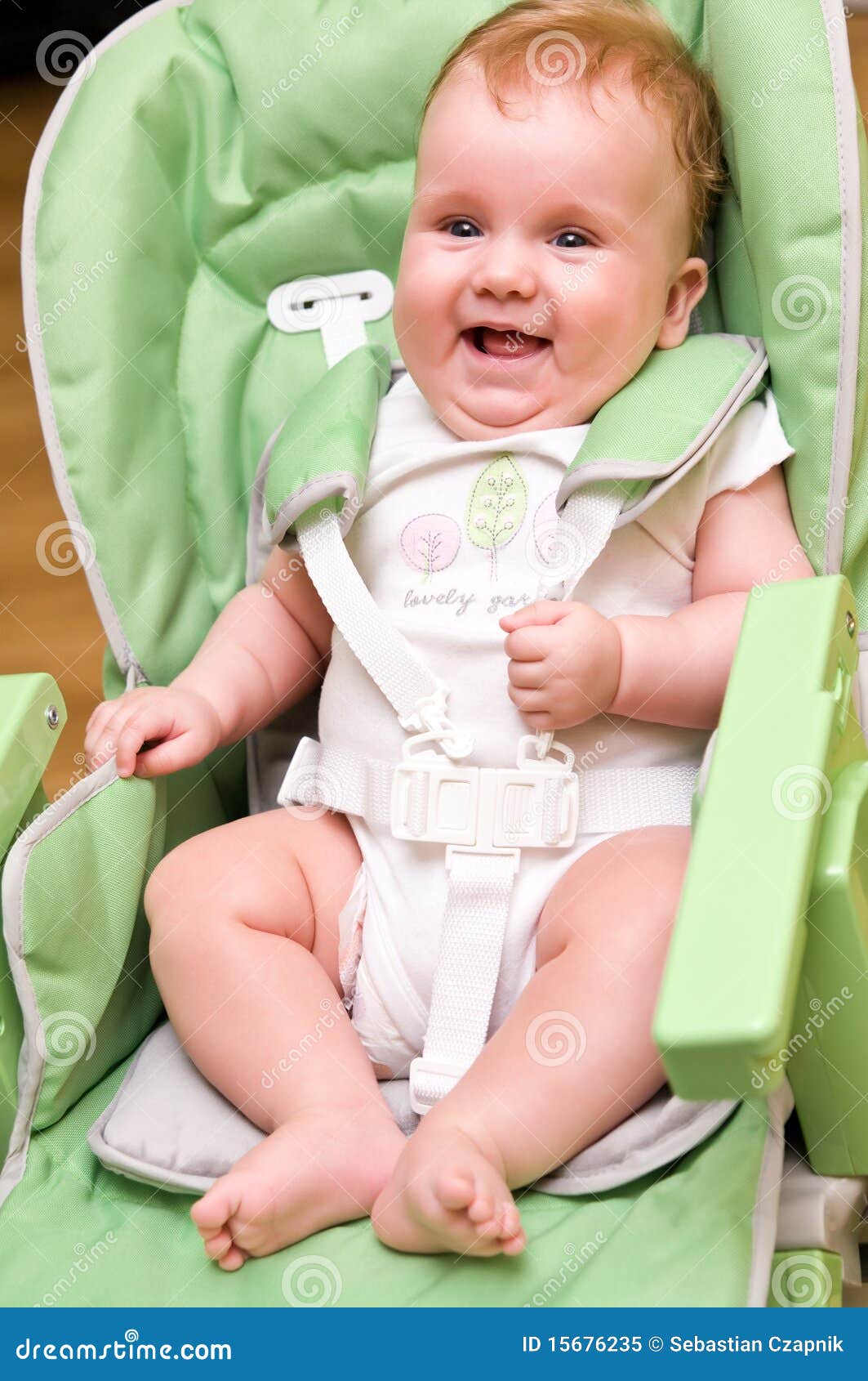 Happy baby in high chair stock image. Image of happy 15676235