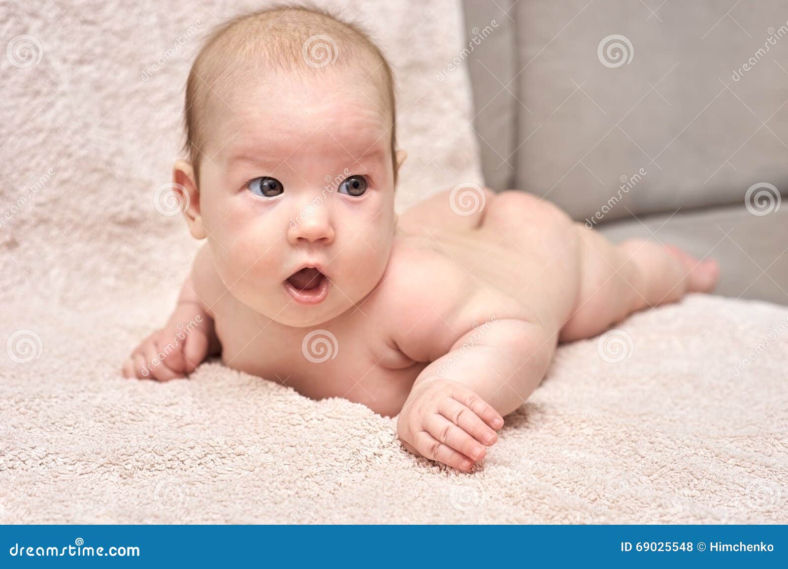Happy Baby Lying on His Stomach Stock Photo Image of sheet, smile