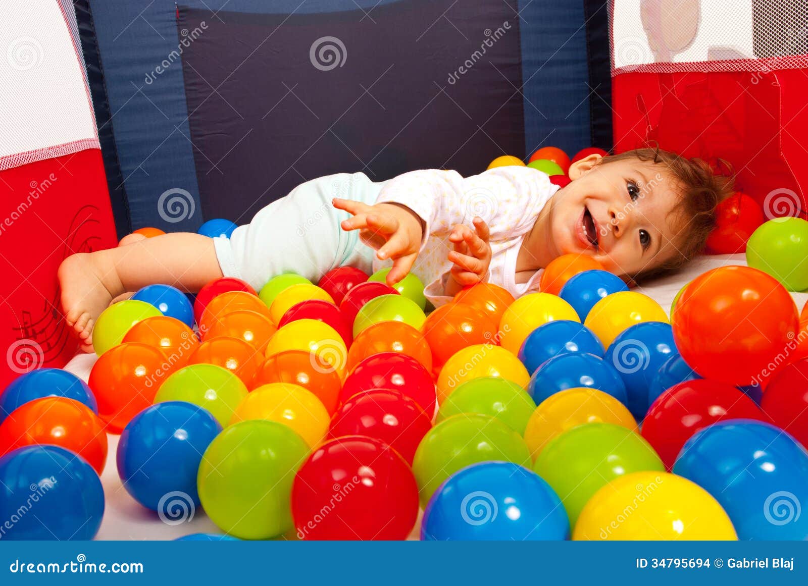 Happy Baby Playing with Balls Stock Photo Image of coloured, colorful